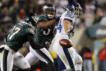 PHILADELPHIA - NOVEMBER 07:  Jacob Tamme #84 of the Indianapolis Colts can not come up with a pass as he is defended by Brandon Graham #54 and Quintin Mickell #27 of the Philadelphia Eagles on November 7, 2010 at Lincoln Financial Field in Philadelphia, P