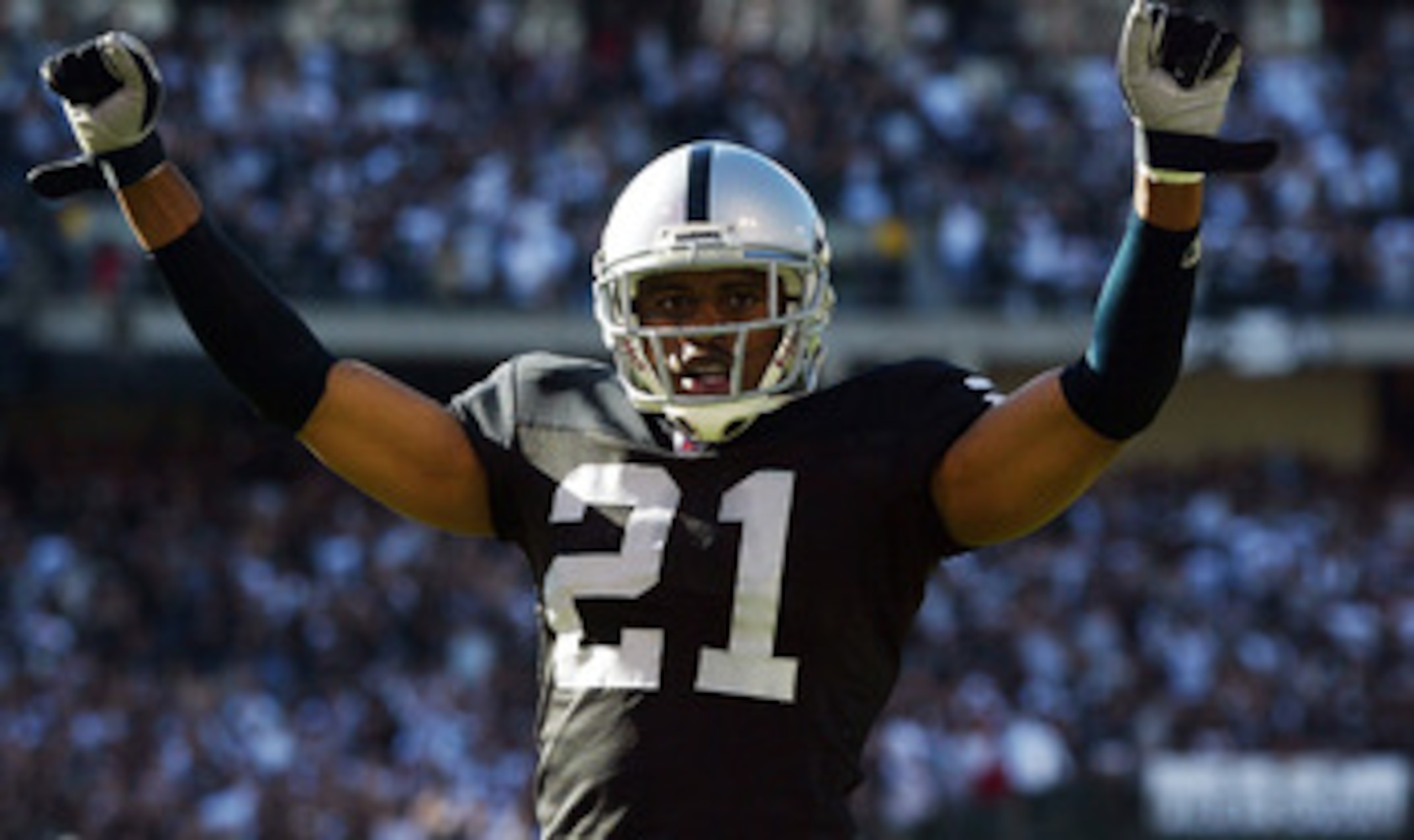OAKLAND, CA - OCTOBER 02:  Nnamdi Asomugha #21 of the Oakland Raiders celebrates after stopping the Dallas Cowboys from scoring in the fourth quarter on October 2, 2005 at McAfee Coliseum in Oakland, California.  (Photo by Jonathan Ferrey/Getty Images)