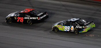 DARLINGTON, SC - MAY 07: Regan Smith, driver of the #78 Furniture Row Companies Chevrolet, leads Carl Edwards, driver of the #99 Aflac Ford, in the final lap of the NASCAR Sprint Cup Series SHOWTIME Southern 500 at Darlington Raceway on May 7, 2011 in Dar