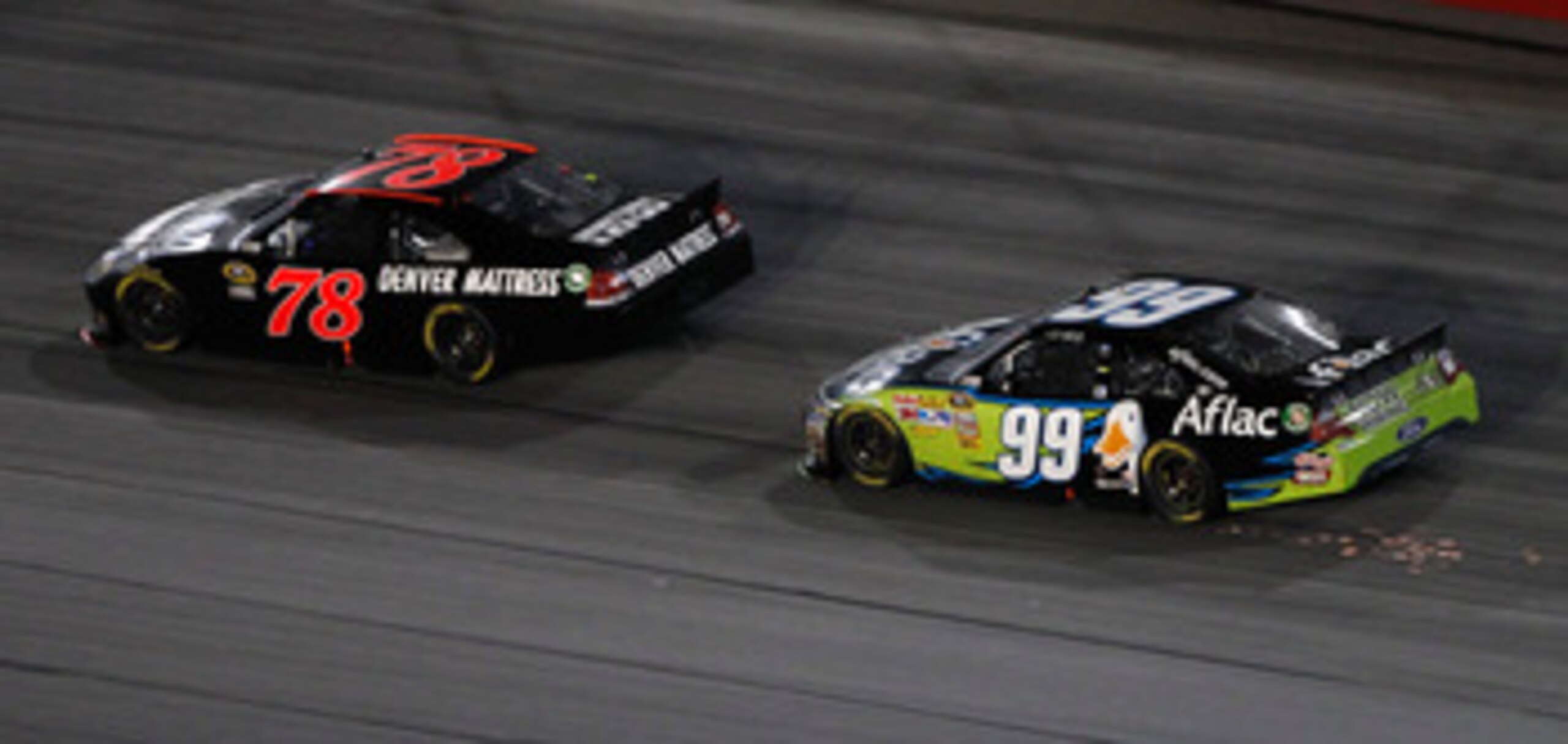 DARLINGTON, SC - MAY 07: Regan Smith, driver of the #78 Furniture Row Companies Chevrolet, leads Carl Edwards, driver of the #99 Aflac Ford, in the final lap of the NASCAR Sprint Cup Series SHOWTIME Southern 500 at Darlington Raceway on May 7, 2011 in Dar