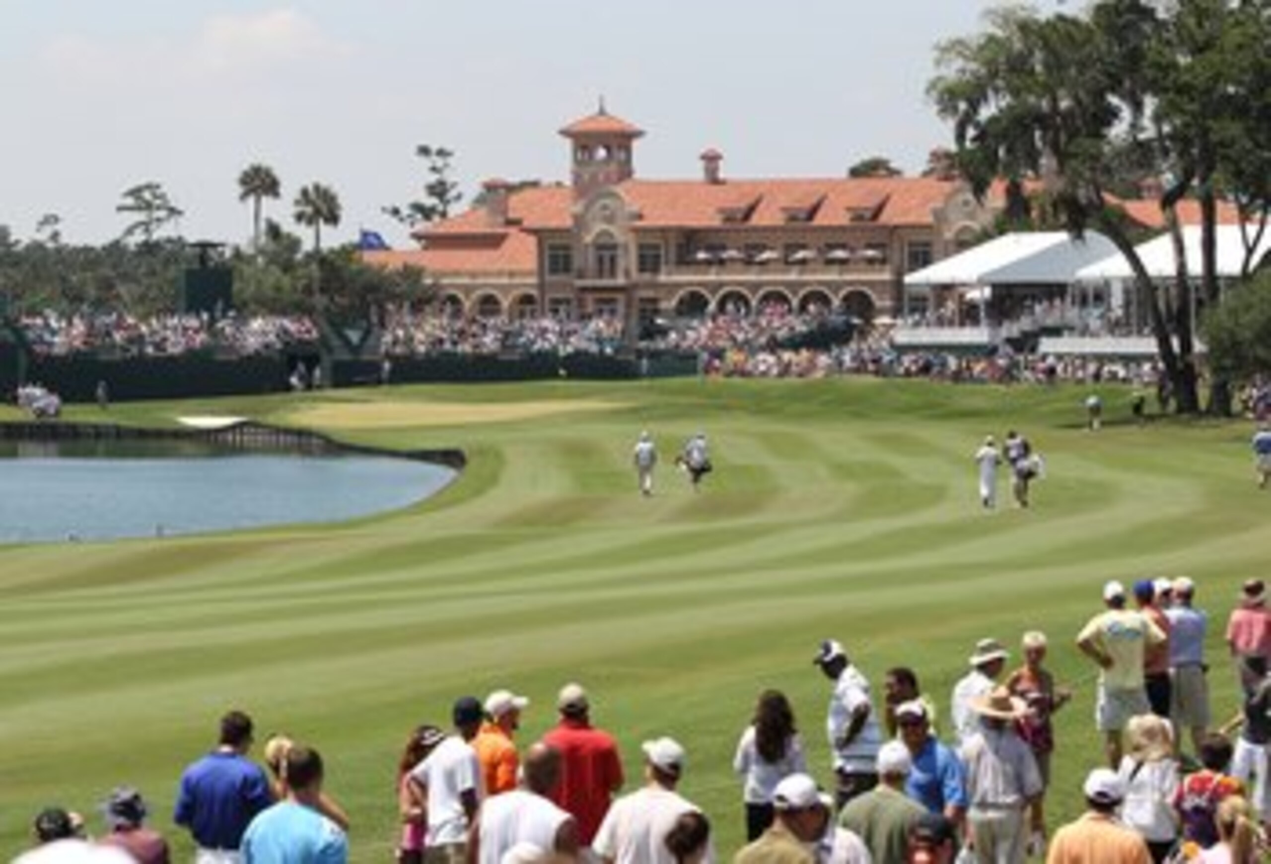 PONTE VEDRA BEACH, FL - MAY 8:  Tiger Woods and Troy Merritt walk up the 18th fairway during the third round of THE PLAYERS Championship on THE PLAYERS Stadium Course at TPC Sawgrass on May 8, 2010 in Ponte Vedra Beach, Florida. (Photo by Jamie Squire/Get