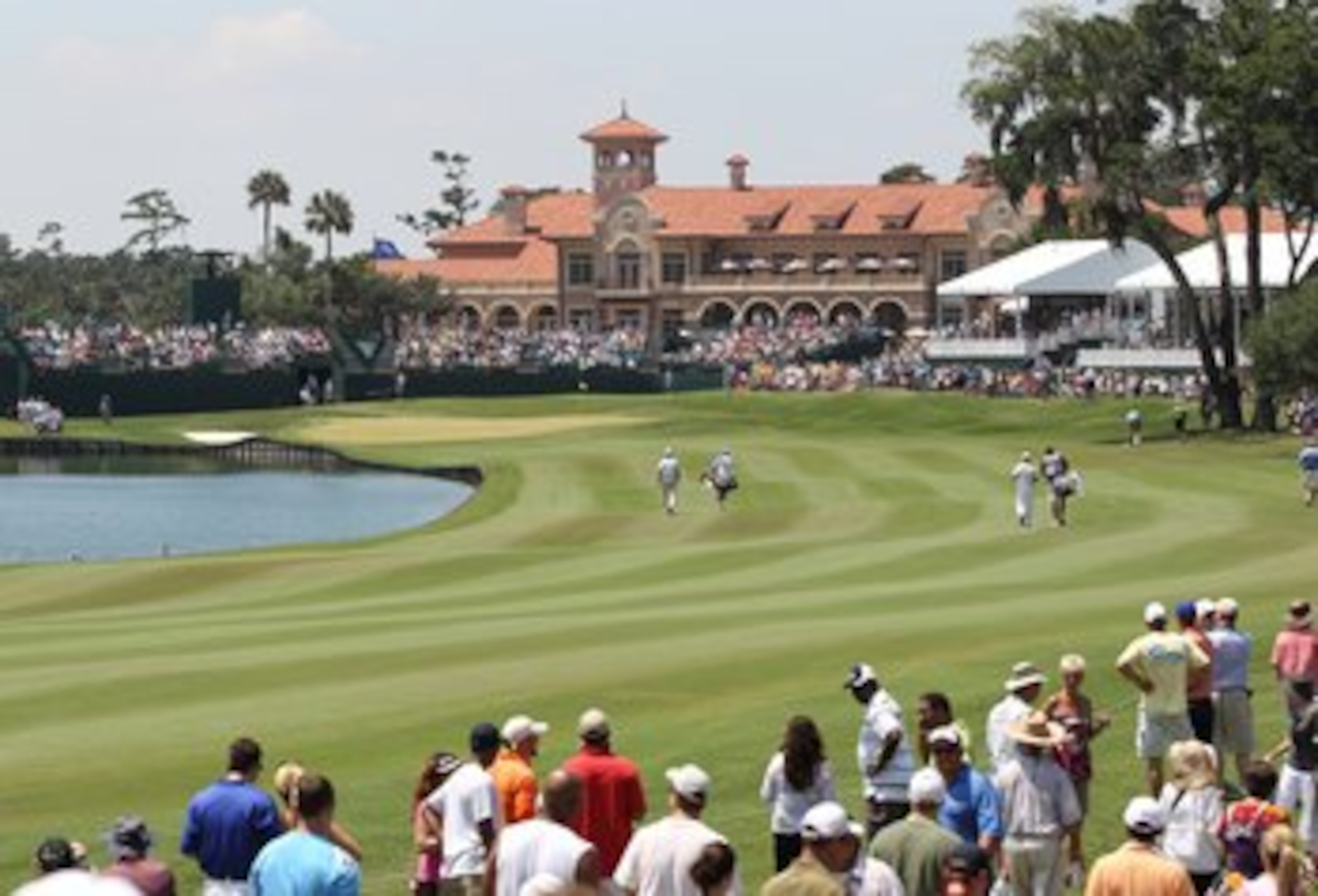 PONTE VEDRA BEACH, FL - MAY 8:  Tiger Woods and Troy Merritt walk up the 18th fairway during the third round of THE PLAYERS Championship on THE PLAYERS Stadium Course at TPC Sawgrass on May 8, 2010 in Ponte Vedra Beach, Florida. (Photo by Jamie Squire/Get