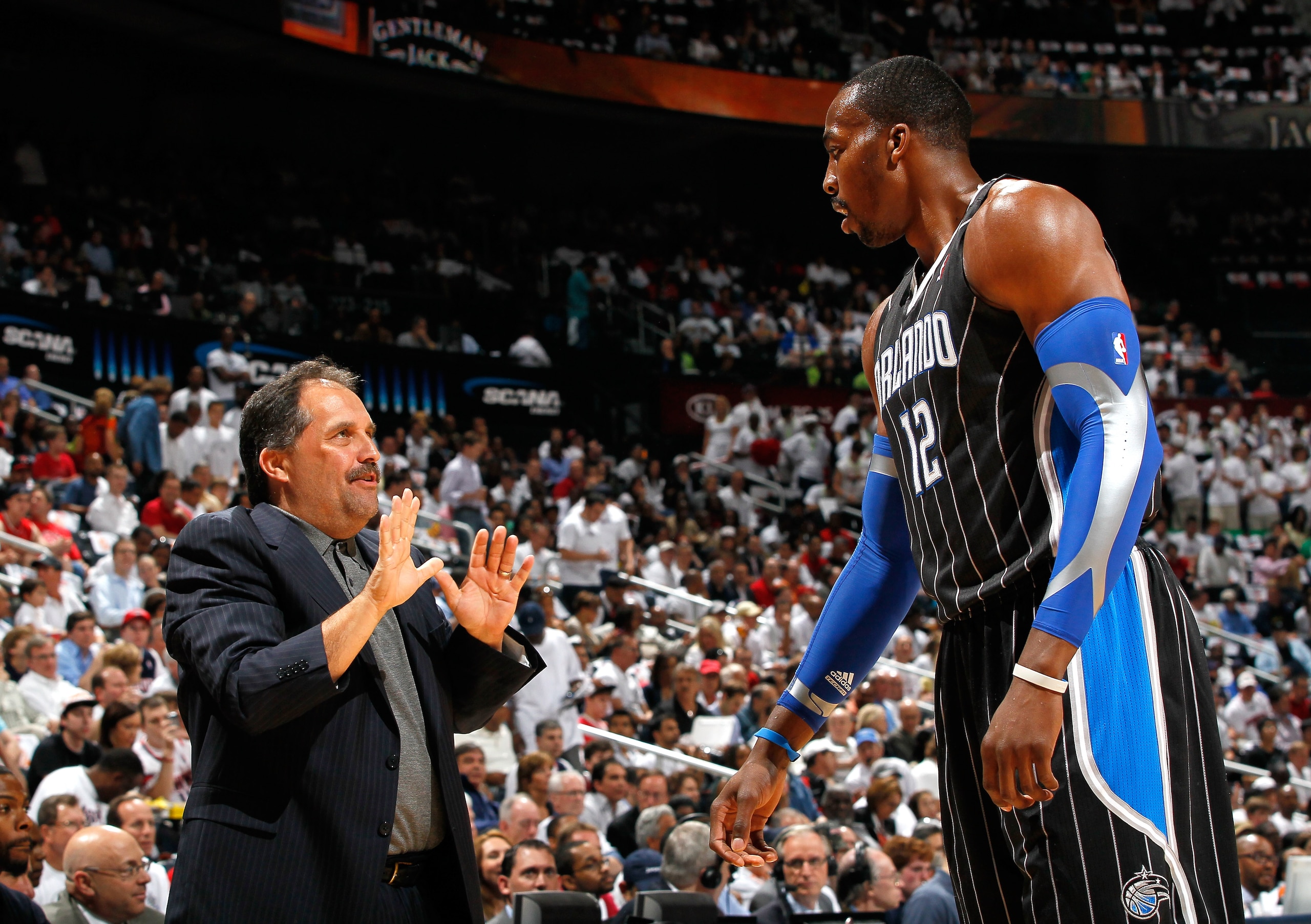 ATLANTA, GA - APRIL 28:  Head coach Stan Van Gundy converses with Dwight Howard #12 of the Orlando Magic during Game Six of the Eastern Conference Quarterfinals in the 2011 NBA Playoffs against the Atlanta Hawks at Philips Arena on April 28, 2011 in Atlan