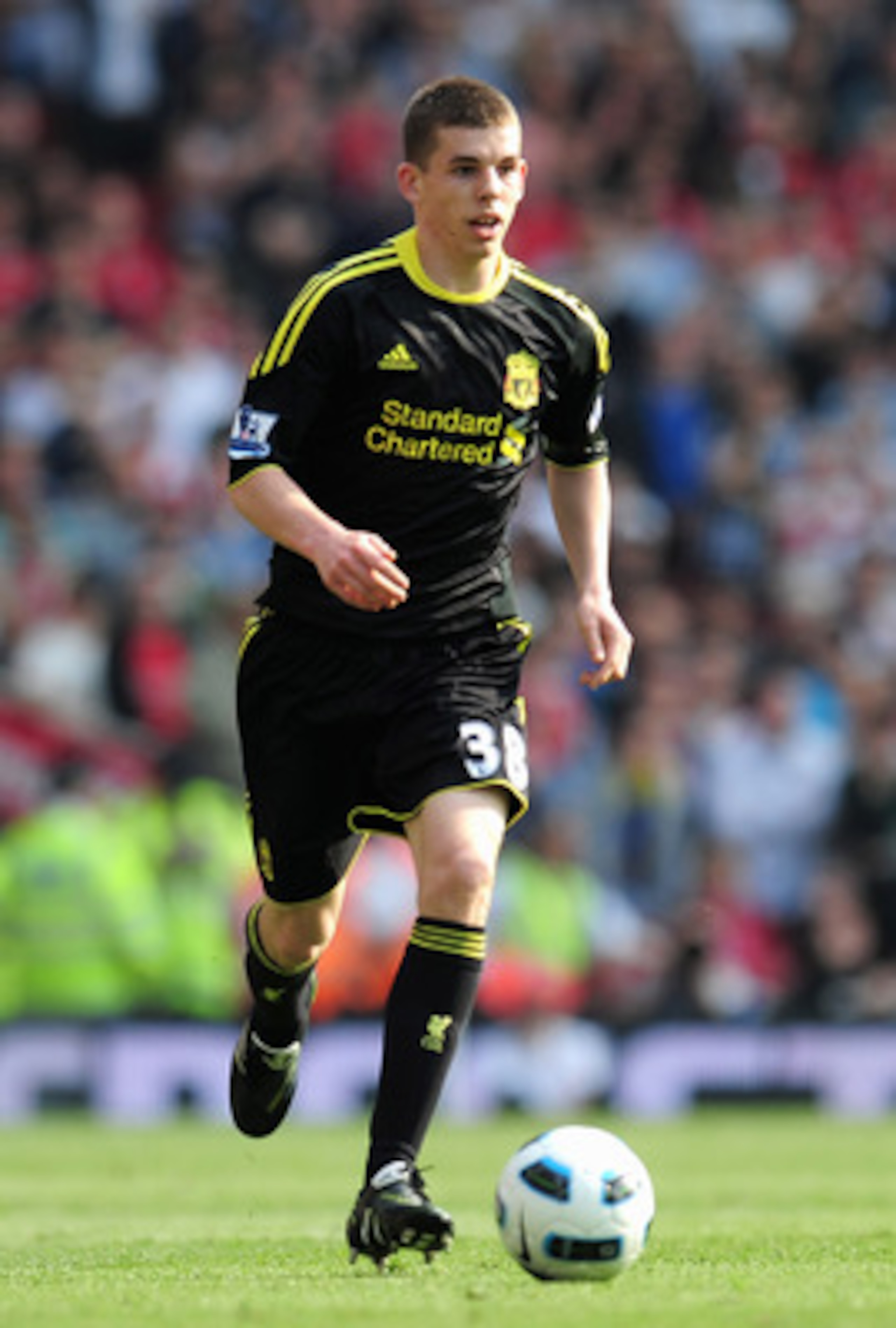 LONDON, ENGLAND - APRIL 17:  John Flanagan of Liverpool runs with the ball during the Barclays Premier League match between Arsenal and Liverpool at the Emirates Stadium on April 17, 2011 in London, England.  (Photo by Shaun Botterill/Getty Images)