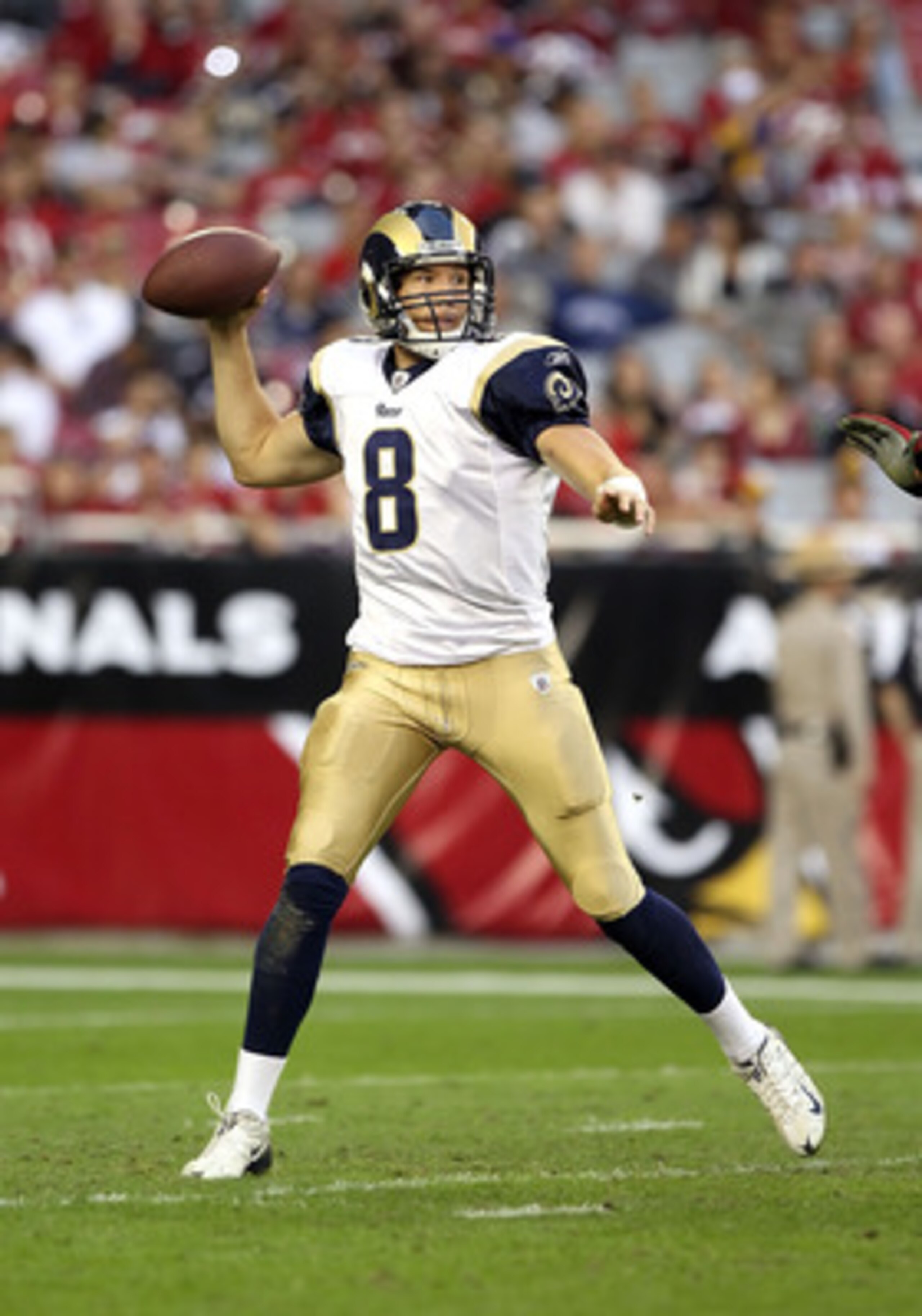 GLENDALE, AZ - DECEMBER 05:  Quarterback Sam Bradford #8 of the St. Louis Rams scrambles with the football during the NFL game against the Arizona Cardinals at the University of Phoenix Stadium on December 5, 2010 in Glendale, Arizona. The Rams defeated t