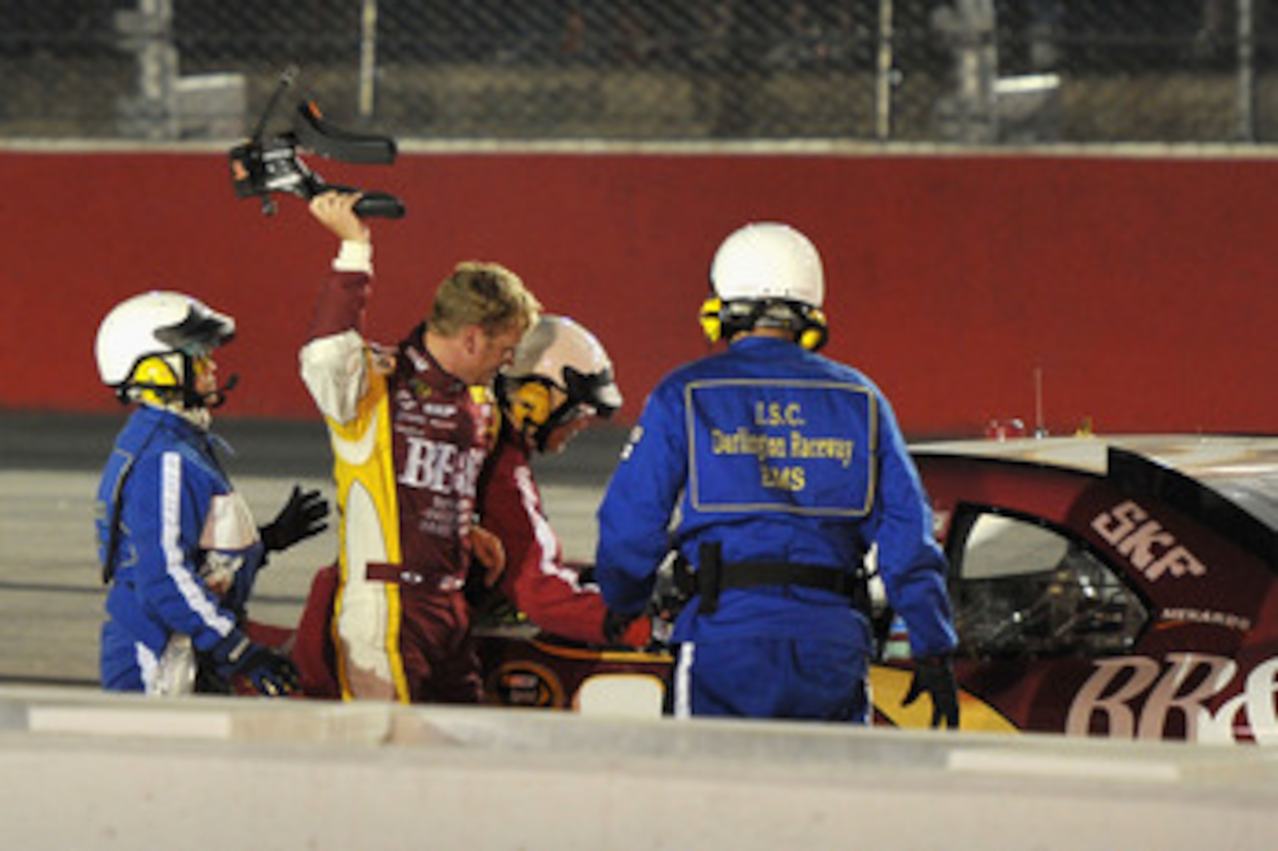DARLINGTON, SC - MAY 07:  Clint Bowyer, driver of the #33 BB&T Chevrolet, throws his harness after crashing late in the race during the NASCAR Sprint Cup Series SHOWTIME Southern 500 at Darlington Raceway on May 7, 2011 in Darlington, South Carolina.  (Ph