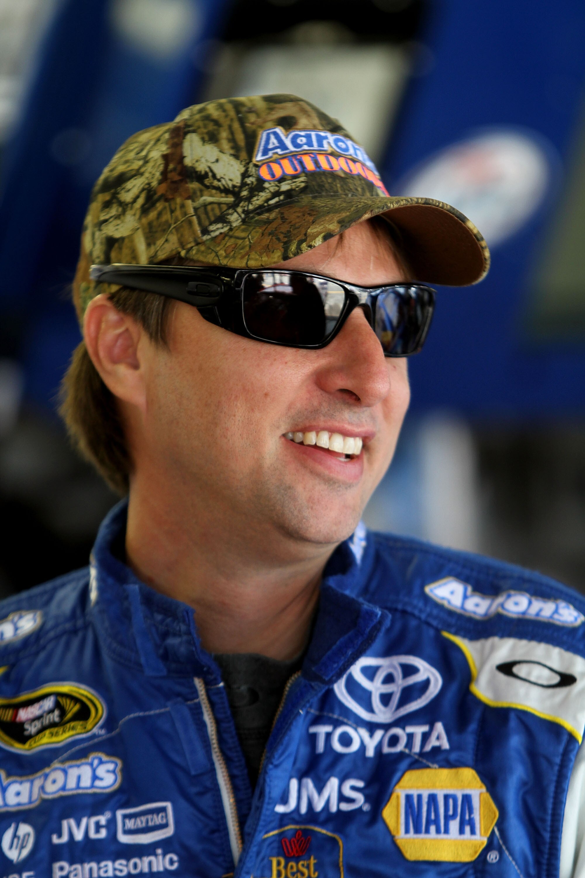 DARLINGTON, SC - MAY 06:  David Reutimann, driver of the #00 Aaron's Outdoors Mossy Oak Toyota, stands in the garage area during practice for the NASCAR Sprint Cup Series SHOWTIME Southern 500 at Darlington Raceway on May 6, 2011 in Darlington, South Caro