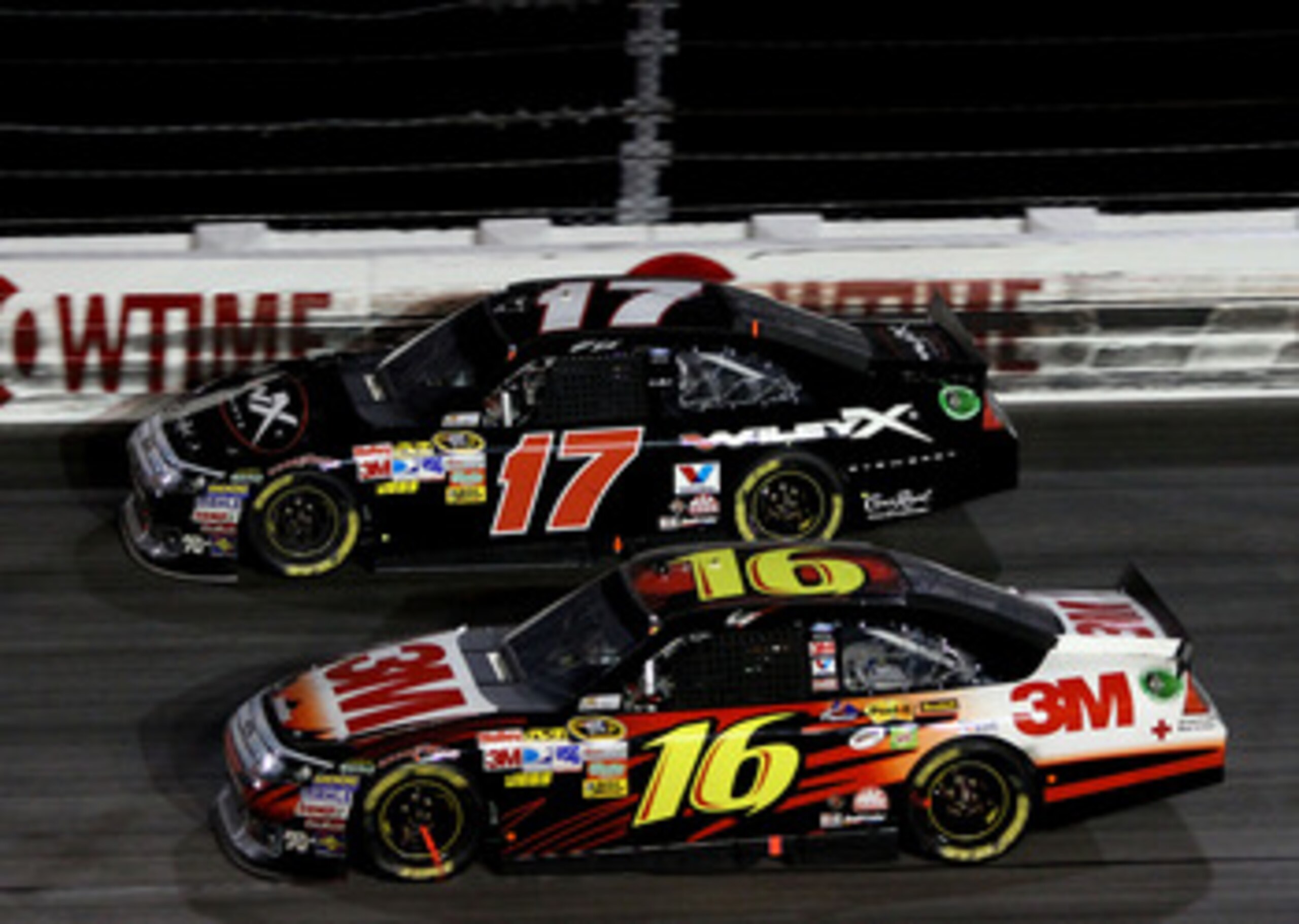 DARLINGTON, SC - MAY 07: Greg Biffle, driver of the #16 3M Ford races with Matt Kenseth, driver of the #17 Wiley X Eyewear Ford, during the NASCAR Sprint Cup Series SHOWTIME Southern 500 at Darlington Raceway on May 7, 2011 in Darlington, South Carolina. 