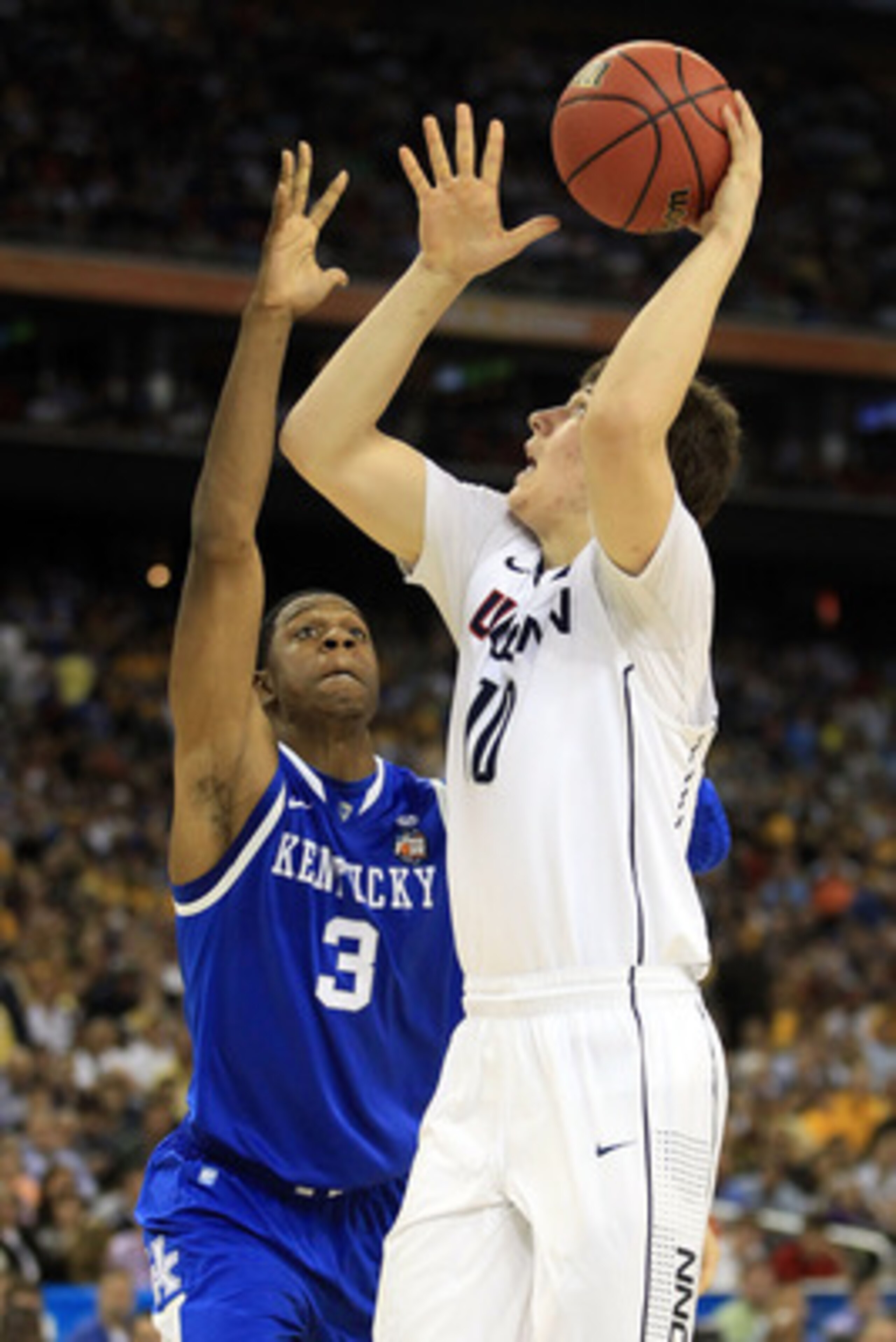 HOUSTON, TX - APRIL 02:  Tyler Olander #10 of the Connecticut Huskies goes to the hoop against Terrence Jones #3 of the Kentucky Wildcats during the National Semifinal game of the 2011 NCAA Division I Men's Basketball Championship at Reliant Stadium on Ap