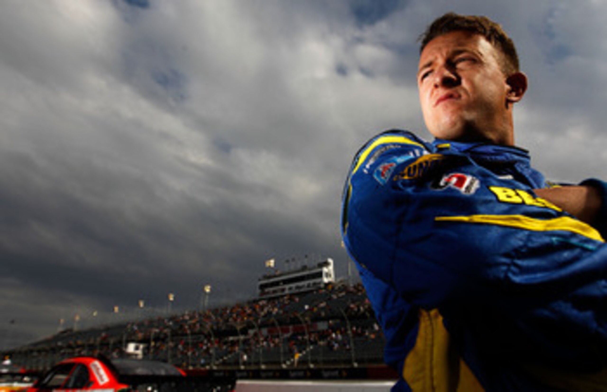 DARLINGTON, SC - MAY 06:  A.J. Allmendinger, driver of the #43 Best Buy Ford, stands on the grid during qualifying for the NASCAR Sprint Cup Series SHOWTIME Southern 500 at Darlington Raceway on May 6, 2011 in Darlington, South Carolina.  (Photo by Tom Pe