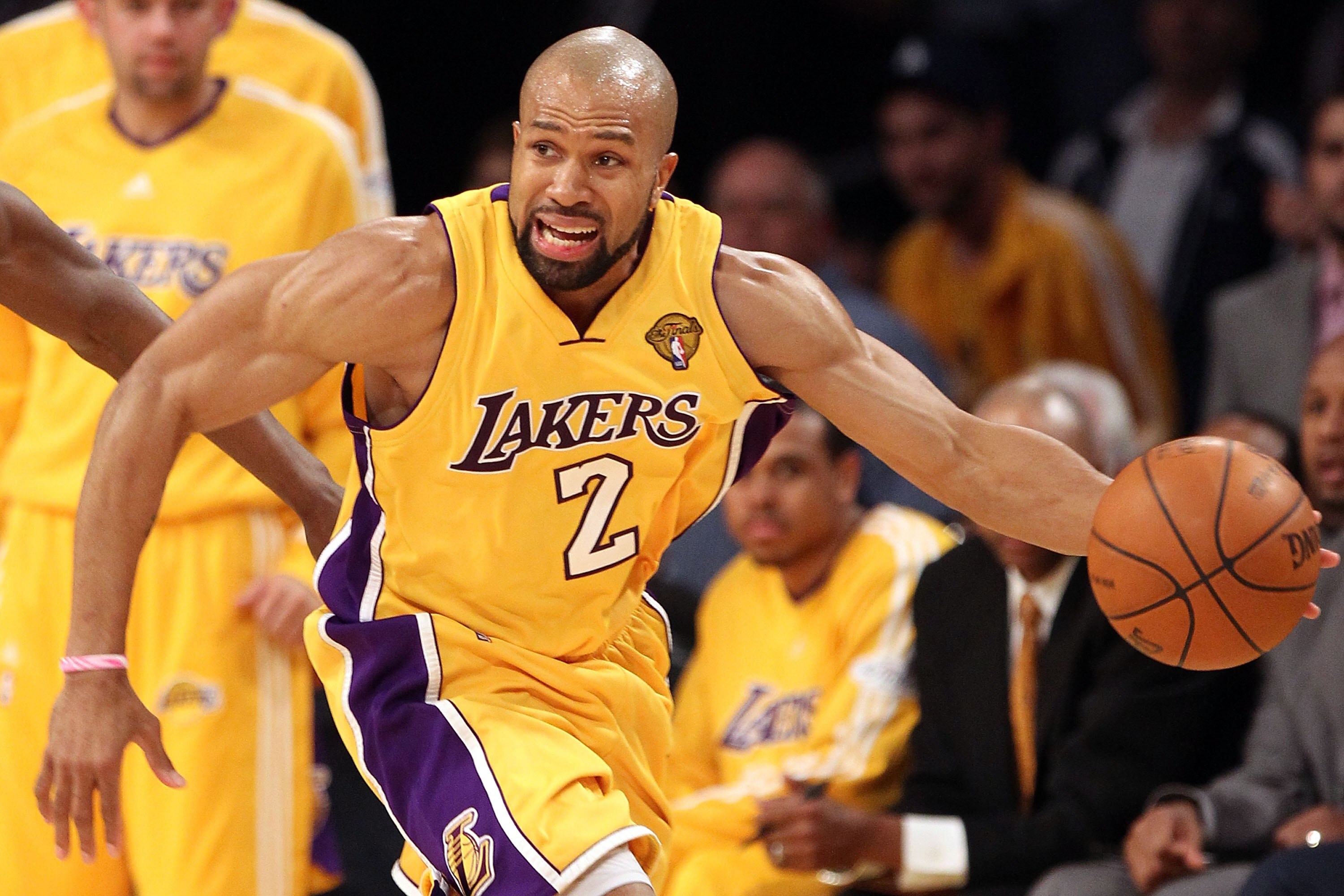 LOS ANGELES, CA - JUNE 17:  Derek Fisher #2 of the Los Angeles Lakers moves the ball in Game Seven of the 2010 NBA Finals against the Boston Celtics at Staples Center on June 17, 2010 in Los Angeles, California.  NOTE TO USER: User expressly acknowledges