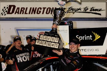 DARLINGTON, SC - MAY 07:  Regan Smith, driver of the #78 Furniture Row Companies Chevrolet, celebrates with in Victory Lane after winning the NASCAR Sprint Cup Series SHOWTIME Southern 500 at Darlington Raceway on May 7, 2011 in Darlington, South Carolina