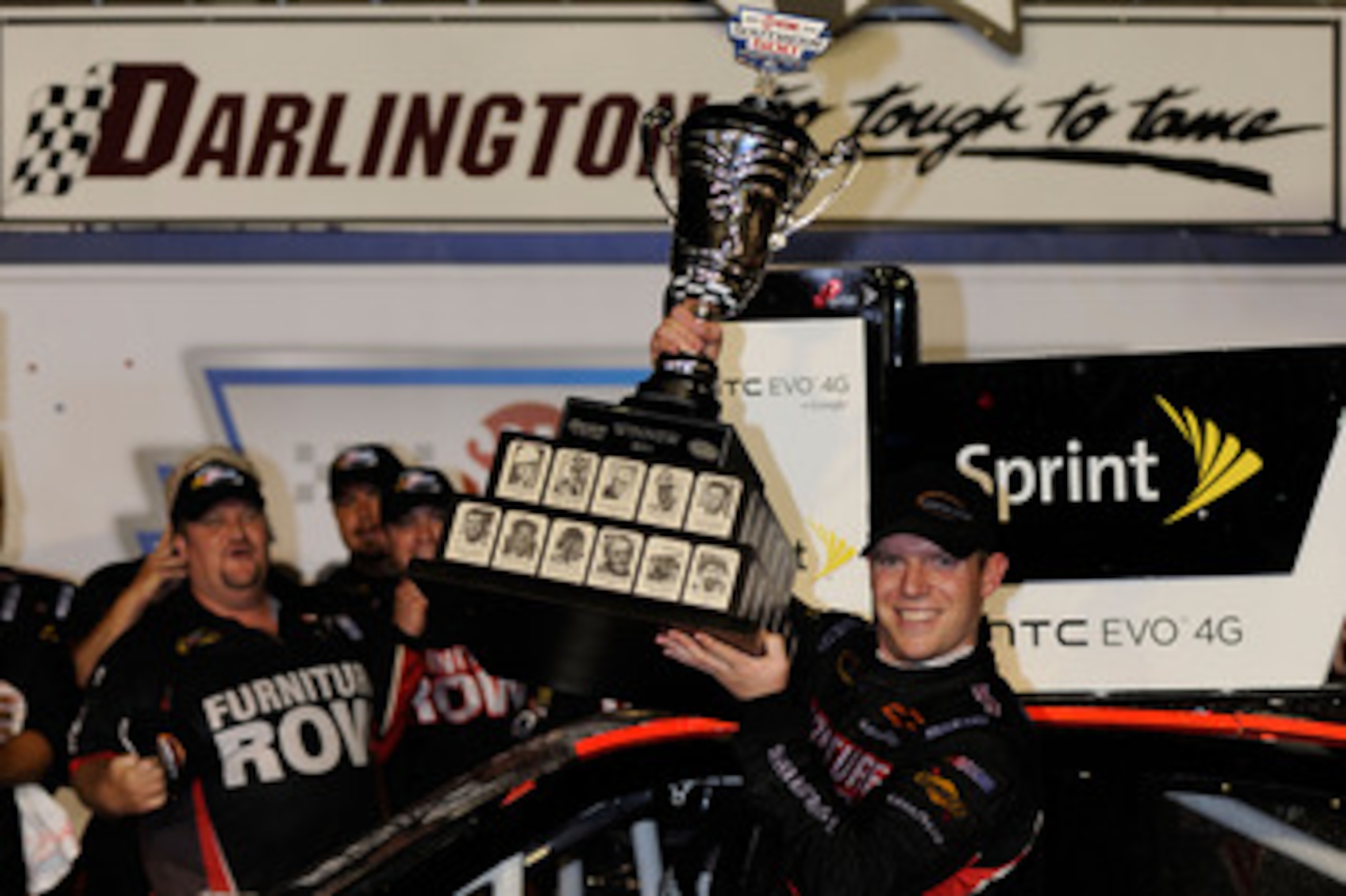 DARLINGTON, SC - MAY 07:  Regan Smith, driver of the #78 Furniture Row Companies Chevrolet, celebrates with in Victory Lane after winning the NASCAR Sprint Cup Series SHOWTIME Southern 500 at Darlington Raceway on May 7, 2011 in Darlington, South Carolina