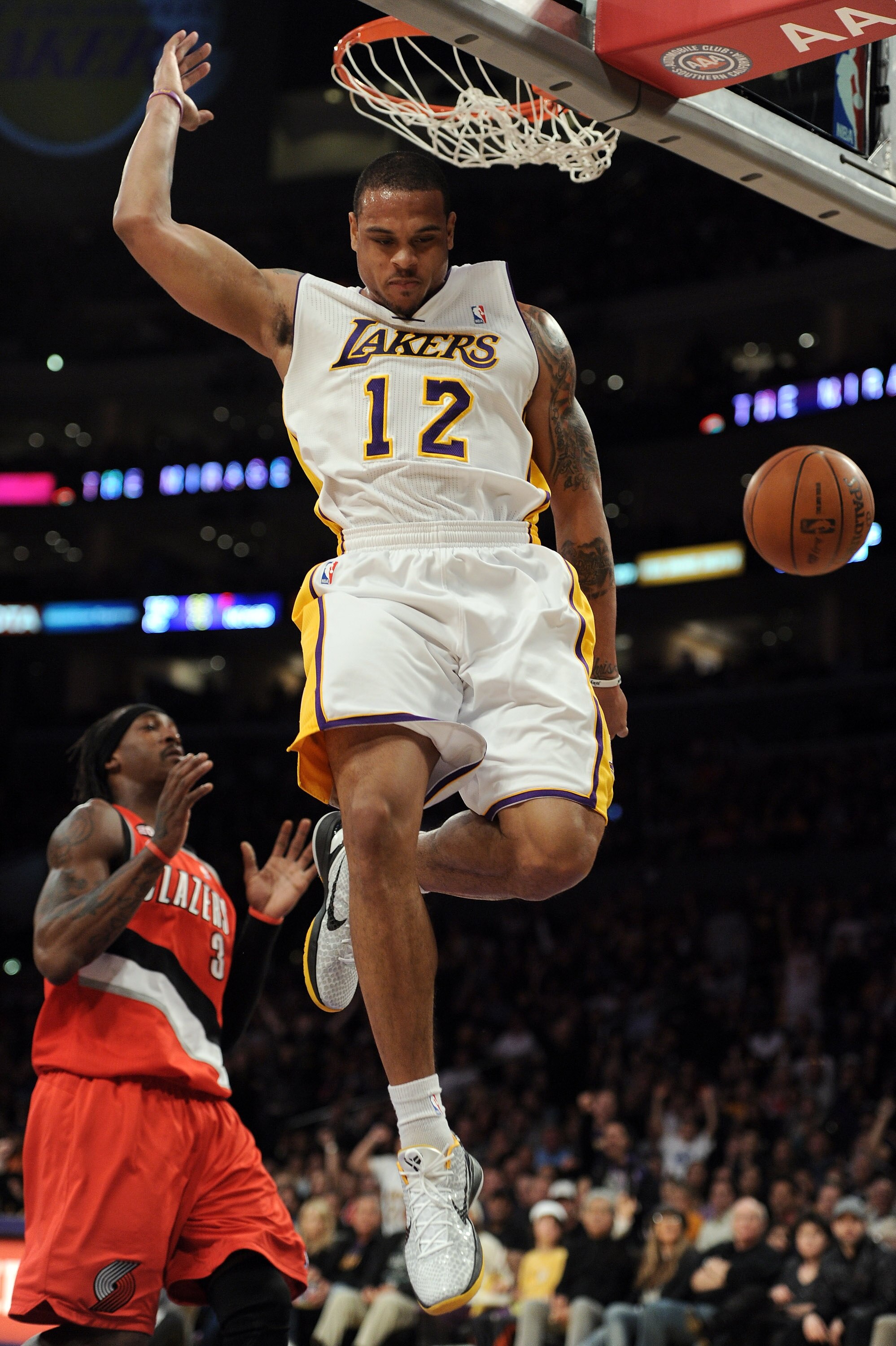 LOS ANGELES, CA - MARCH 20:  Shannon Brown #12 of the Los Angeles Lakers dunks the ball in front of Gerald Wallace #3 of the Portland Trail Blazers at the Staples Center on March 20, 2011 in Los Angeles, California.  NOTE TO USER: User expressly acknowled