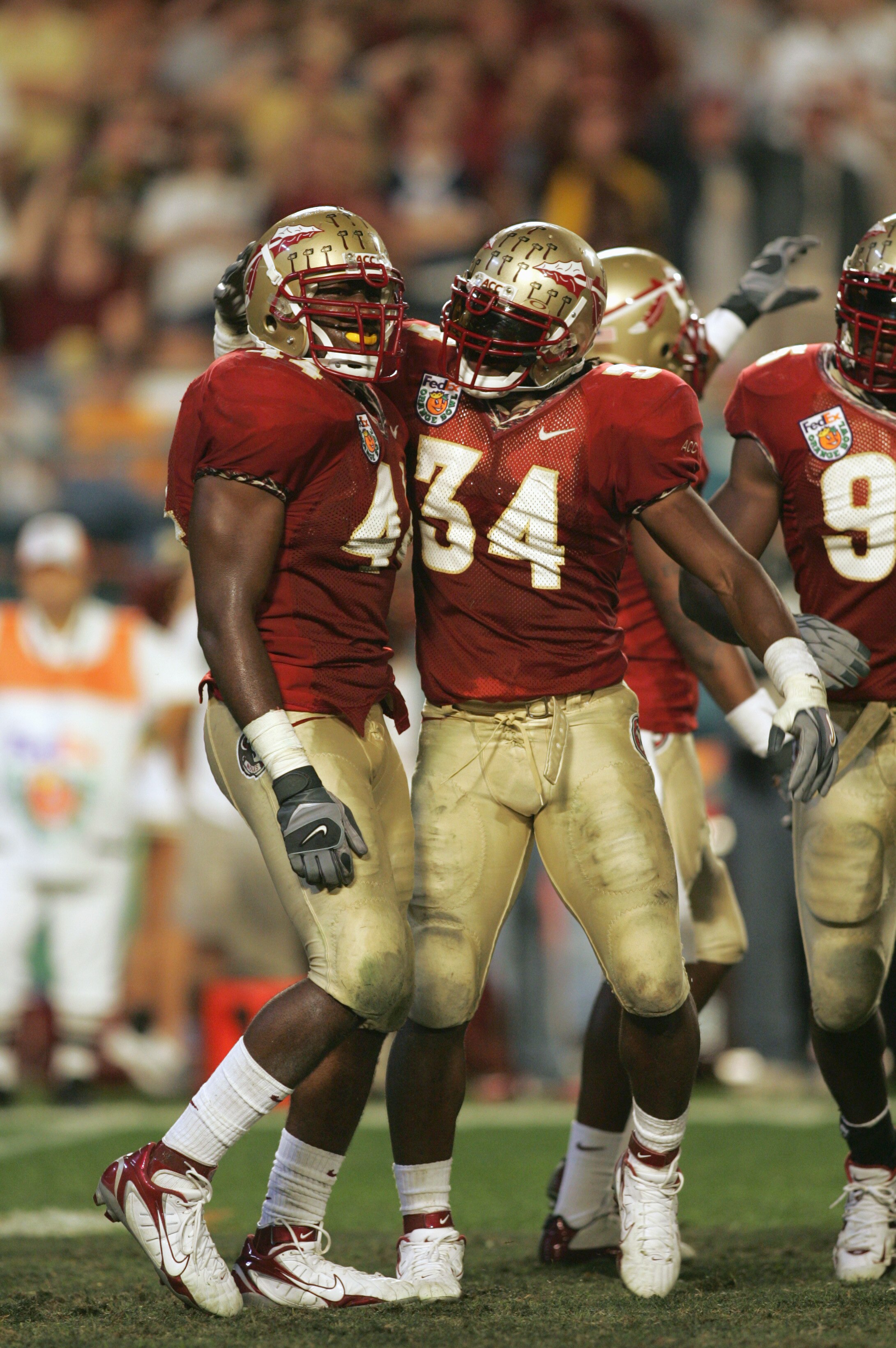 MIAMI GARDENS, FL - JANUARY 3:  Ernie Sims #34of the Florida State Seminoles congratuales Sam McGrew #44 during the 72nd Fed Ex Orange Bowl against the Penn State Nittany Lions at Dolphins Stadium on January 3, 2005 in Miami Gardens, Florida. Penn State d