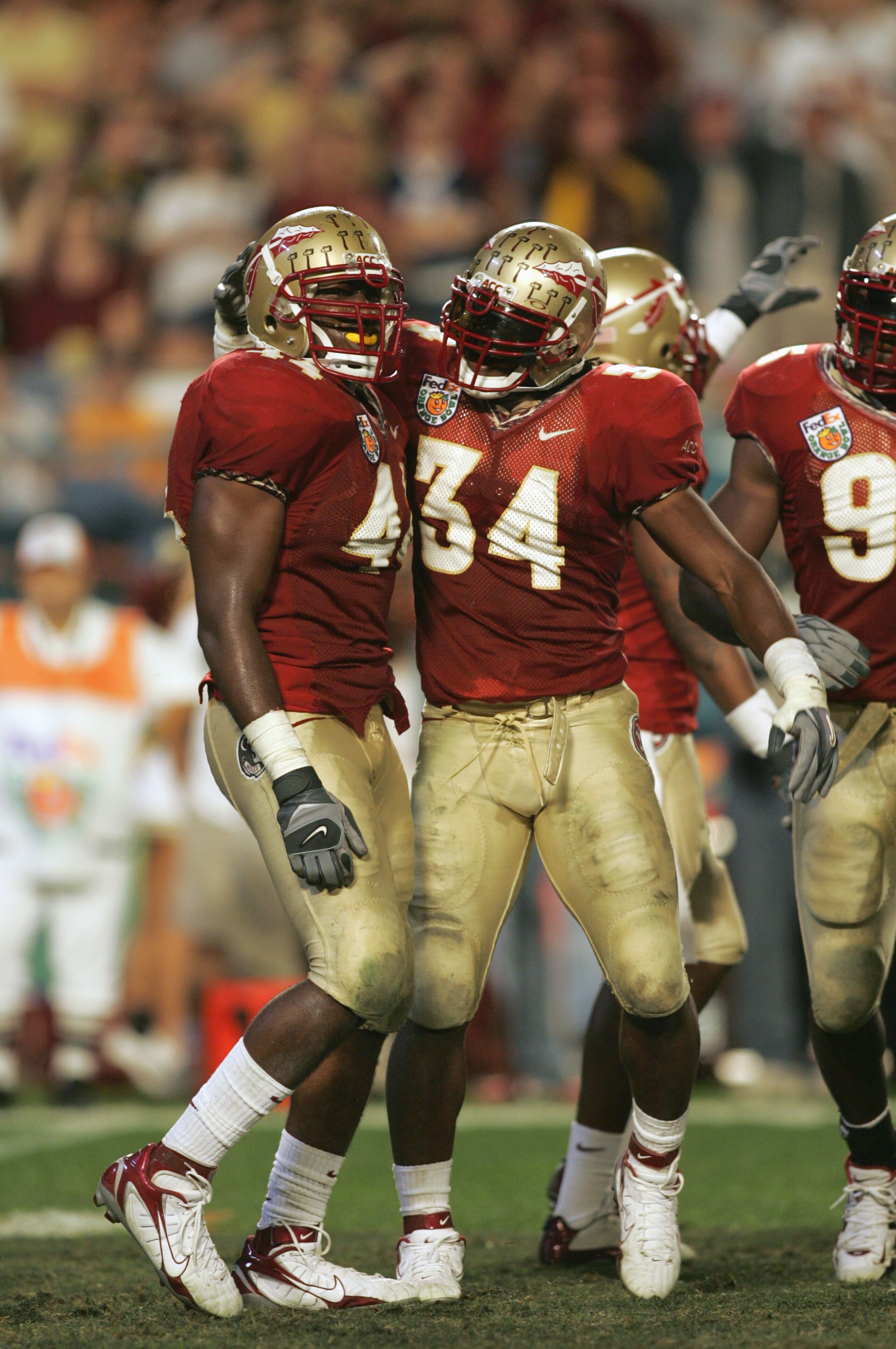 MIAMI GARDENS, FL - JANUARY 3:  Ernie Sims #34of the Florida State Seminoles congratuales Sam McGrew #44 during the 72nd Fed Ex Orange Bowl against the Penn State Nittany Lions at Dolphins Stadium on January 3, 2005 in Miami Gardens, Florida. Penn State d