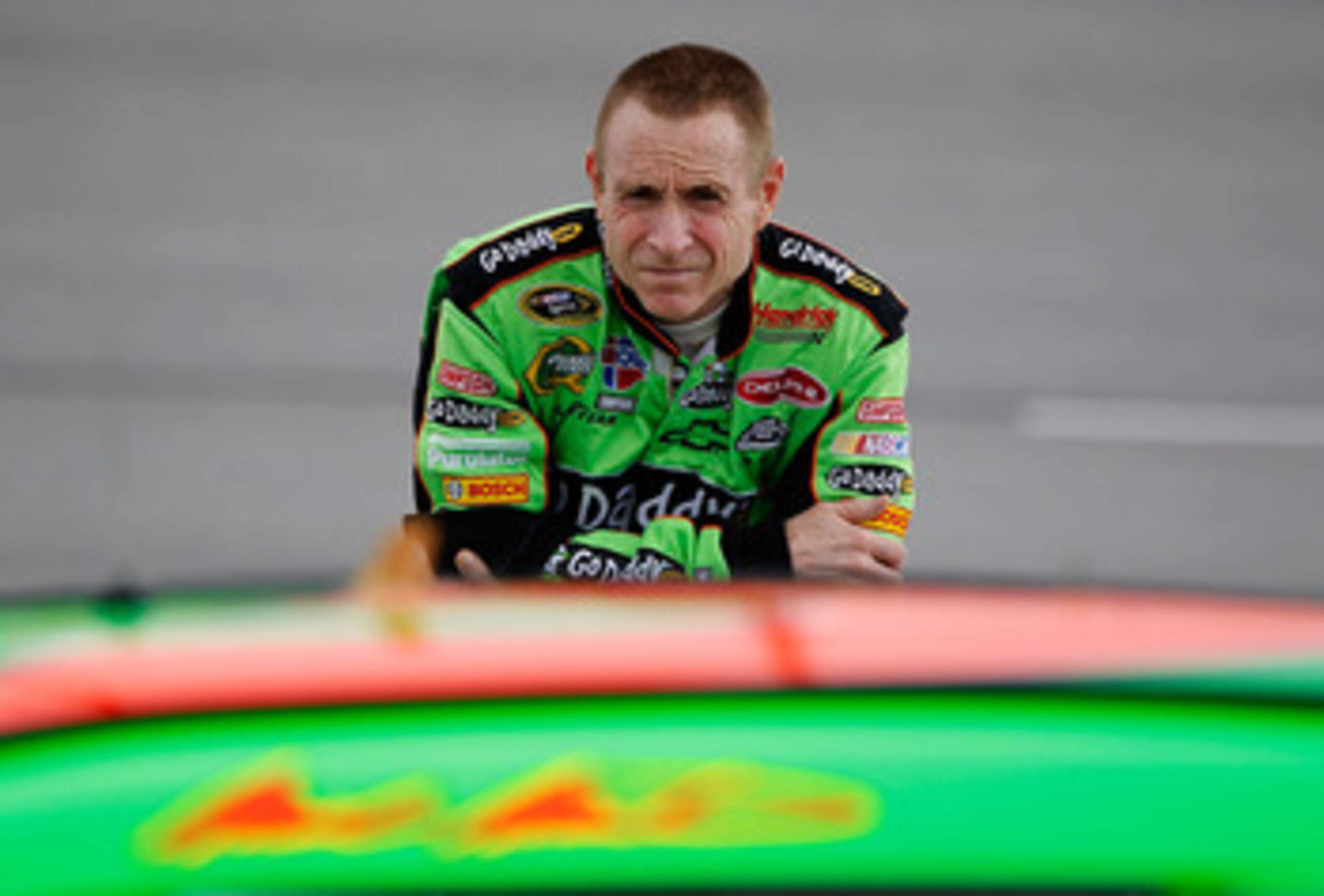 DARLINGTON, SC - MAY 06:  Mark Martin, driver of the #5 Carquest/GoDaddy.com Chevrolet, stands on the grid during qualifying for the NASCAR Sprint Cup Series SHOWTIME Southern 500 at Darlington Raceway on May 6, 2011 in Darlington, South Carolina.  (Photo