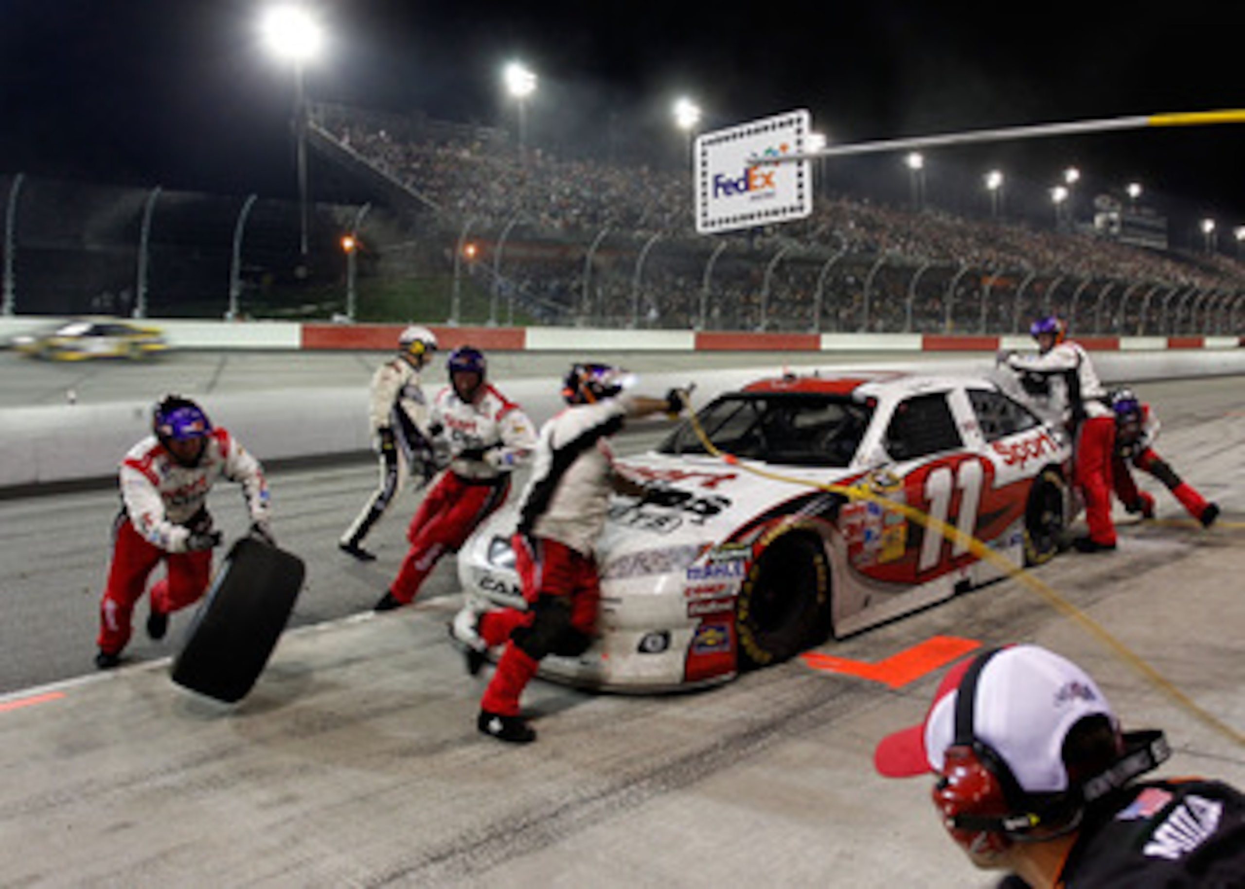 DARLINGTON, SC - MAY 07: Denny Hamlin, driver of the #11 Sport Clips Toyota, pits during the NASCAR Sprint Cup Series SHOWTIME Southern 500 at Darlington Raceway on May 7, 2011 in Darlington, South Carolina.  (Photo by Geoff Burke/Getty Images for NASCAR)
