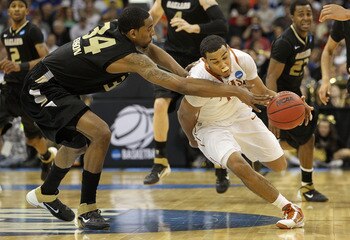 TULSA, OK - MARCH 18: Cory Joseph #5 of the Texas Longhorns drives with the ball against Keith Benson #34 of the Oakland Golden Grizzlies during the second round of the 2011 NCAA men's basketball tournament at BOK Center on March 18, 2011 in Tulsa, Oklah TULSA, OK - MARCH 18: Cory Joseph #5 of the Texas Longhorns drives with the ball against Keith Benson #34 of the Oakland Golden Grizzlies during the second round of the 2011 NCAA men's basketball tournament at BOK Center on March 18, 2011 in Tulsa, Oklah