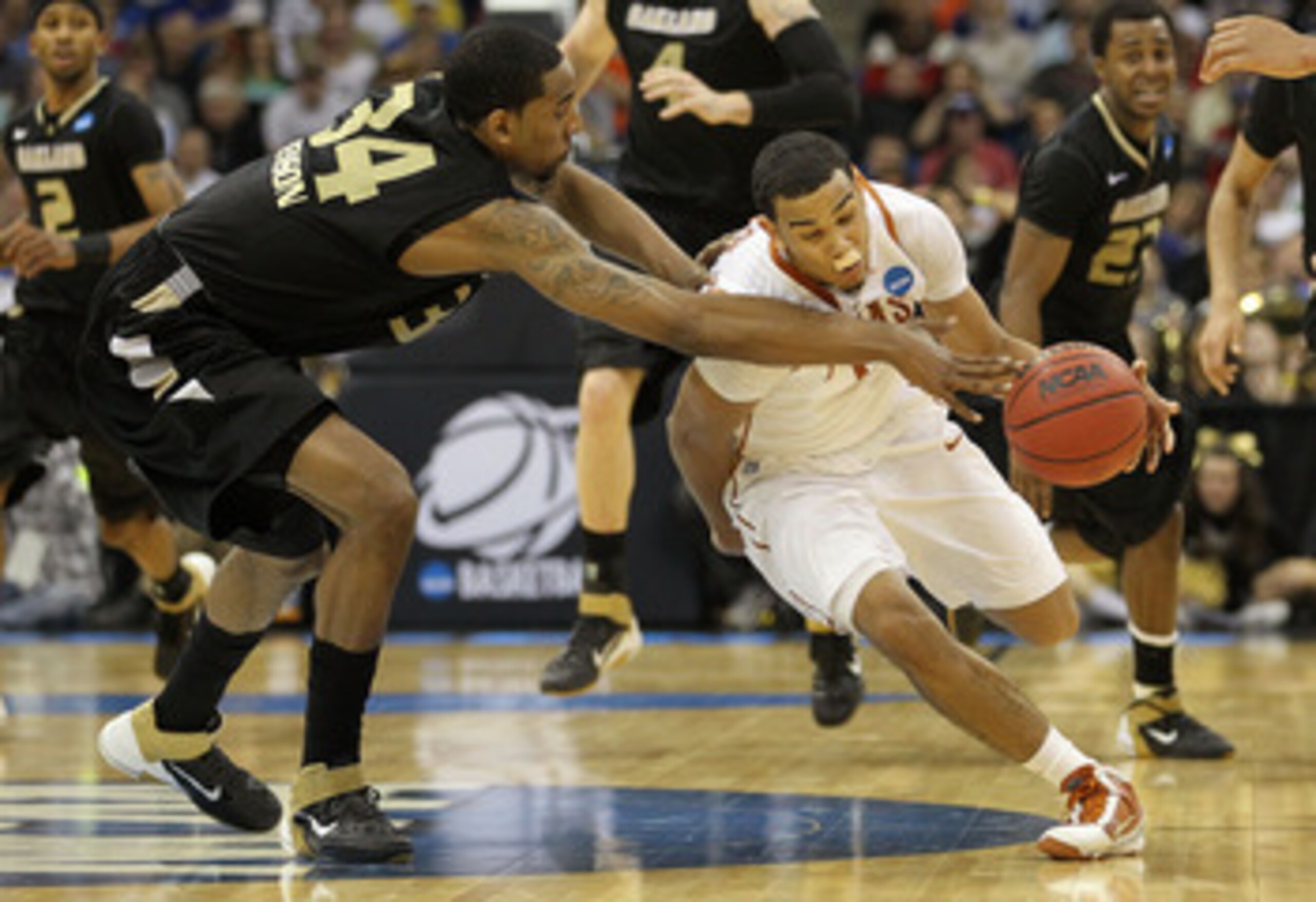 TULSA, OK - MARCH 18:  Cory Joseph #5 of the Texas Longhorns drives with the ball against Keith Benson #34 of the Oakland Golden Grizzlies during the second round of the 2011 NCAA men's basketball tournament at BOK Center on March 18, 2011 in Tulsa, Oklah