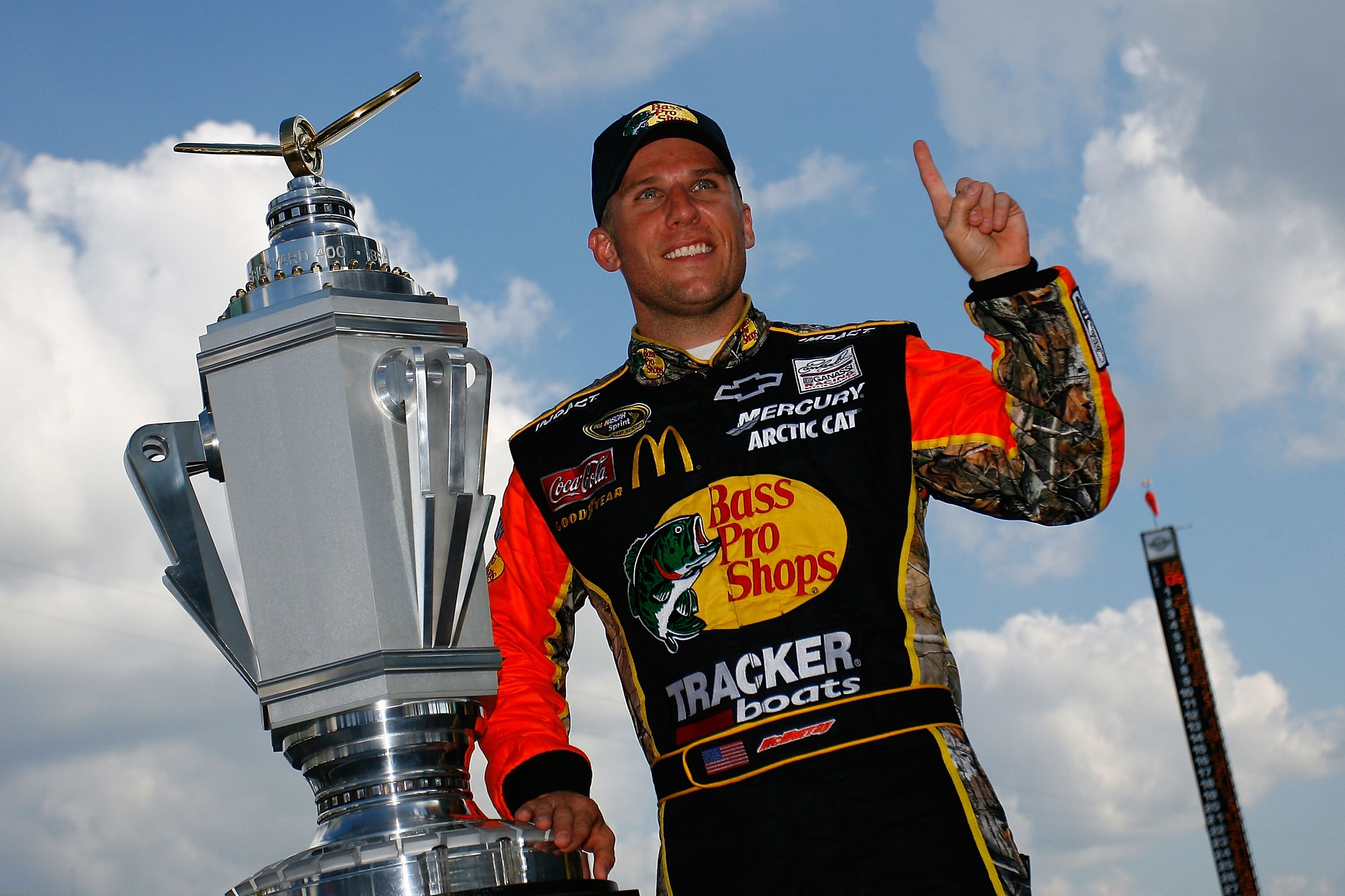 INDIANAPOLIS - JULY 25:  Jamie McMurray, driver of the #1 Bass Pro Shops/Tracker Boats Chevrolet, poses with the Brickyard 400 Trophy after winning the NASCAR Sprint Cup Series Brickyard 400 at Indianapolis Motor Speedway on July 25, 2010 in Indianapolis,