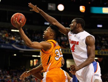 ATLANTA, GA - MARCH 11: Scotty Hopson #32 of the Tennessee Volunteers goes up for a shot in front of Patric Young #4 of the Florida Gators during the quarterfinals of the SEC Men's Basketball Tournament at Georgia Dome on March 11, 2011 in Atlanta, Georg ATLANTA, GA - MARCH 11: Scotty Hopson #32 of the Tennessee Volunteers goes up for a shot in front of Patric Young #4 of the Florida Gators during the quarterfinals of the SEC Men's Basketball Tournament at Georgia Dome on March 11, 2011 in Atlanta, Georg