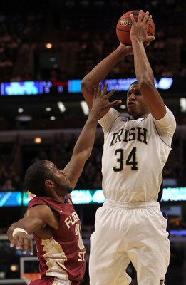 CHICAGO, IL - MARCH 20: Carleton Scott #34 of the Notre Dame Fighting Irish shoots against Michael Snaer #21 of the Florida State Seminoles in the first half during the third round of the 2011 NCAA men's basketball tournament at the United Center on Marc CHICAGO, IL - MARCH 20: Carleton Scott #34 of the Notre Dame Fighting Irish shoots against Michael Snaer #21 of the Florida State Seminoles in the first half during the third round of the 2011 NCAA men's basketball tournament at the United Center on Marc