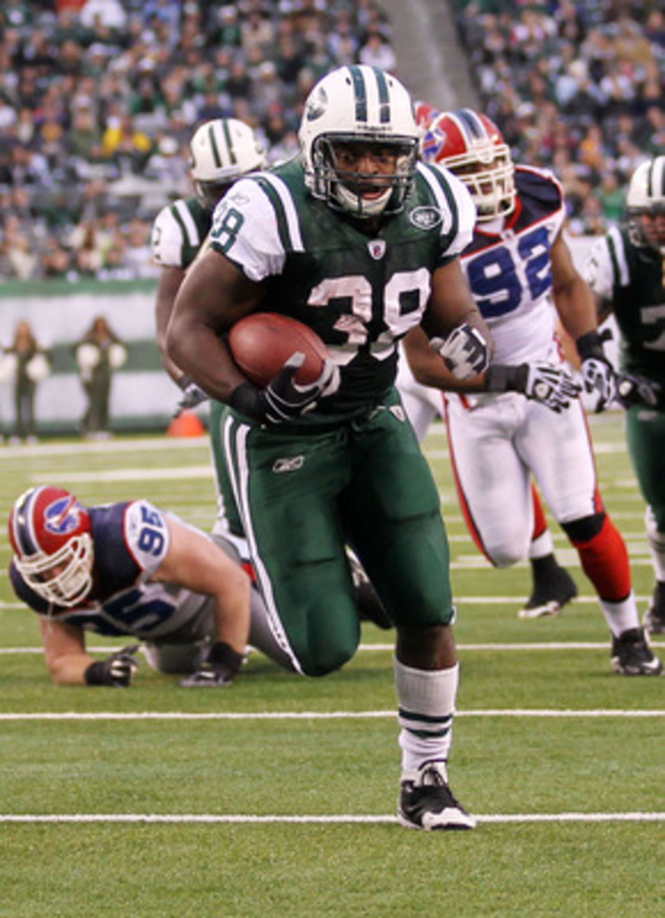 EAST RUTHERFORD, NJ - JANUARY 02:  John Conner #38 of the New York Jets runs for a touchdown against the Buffalo Bills at New Meadowlands Stadium on January 2, 2011 in East Rutherford, New Jersey.  (Photo by Al Bello/Getty Images)