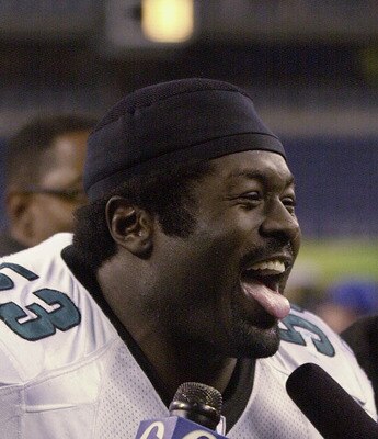 SEATTLE - DECEMBER 08:  Hugh Douglas #53 of the Philadelphia Eagles talks to the media after their NFL game against the Seattle Seahawks at Seahawks Stadium on December 08, 2002 in Seattle Washington.  The Eagles defeated the Seahawks 27-20.  (Photo by Ot