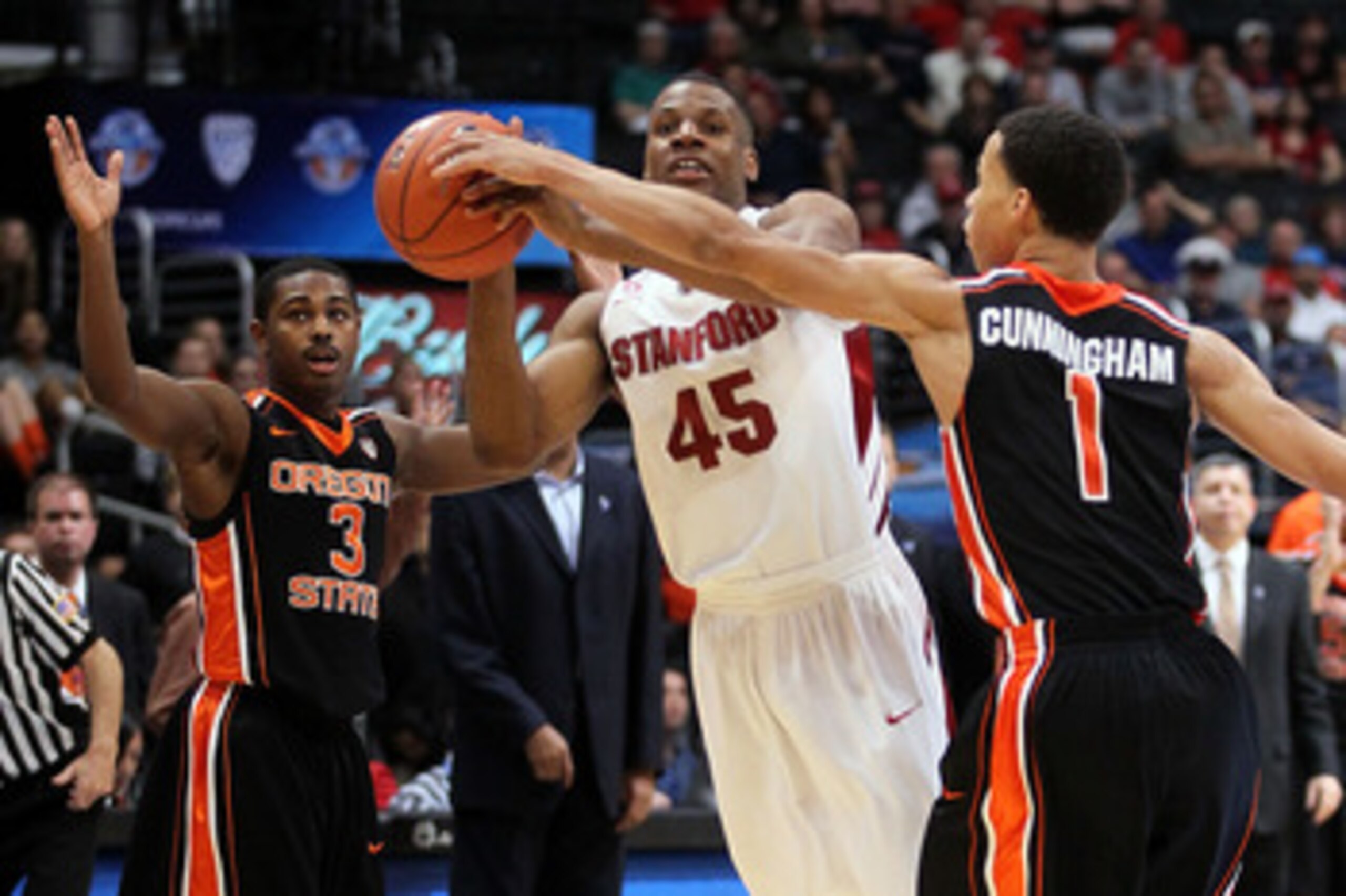 LOS ANGELES, CA - MARCH 09:  Jeremy Green #45 of the Stanford Cardinal has his last second shot attempt blocked by Jared Cunningham #1 of the Oregon State Beavers as the Cardinal lost to the Beavers 69-67 in the first round of the 2011 Pacific Life Pac-10