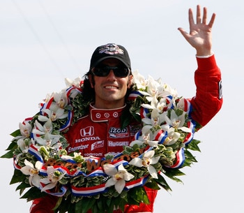 INDIANAPOLIS - MAY 30:  Dario Franchitti of Scotland, driver of the #10 Target Chip Ganassi Racing Dallara Honda, celebrates in victory circle after winning the IZOD IndyCar Series 94th running of the Indianapolis 500 at the Indianapolis Motor Speedway on