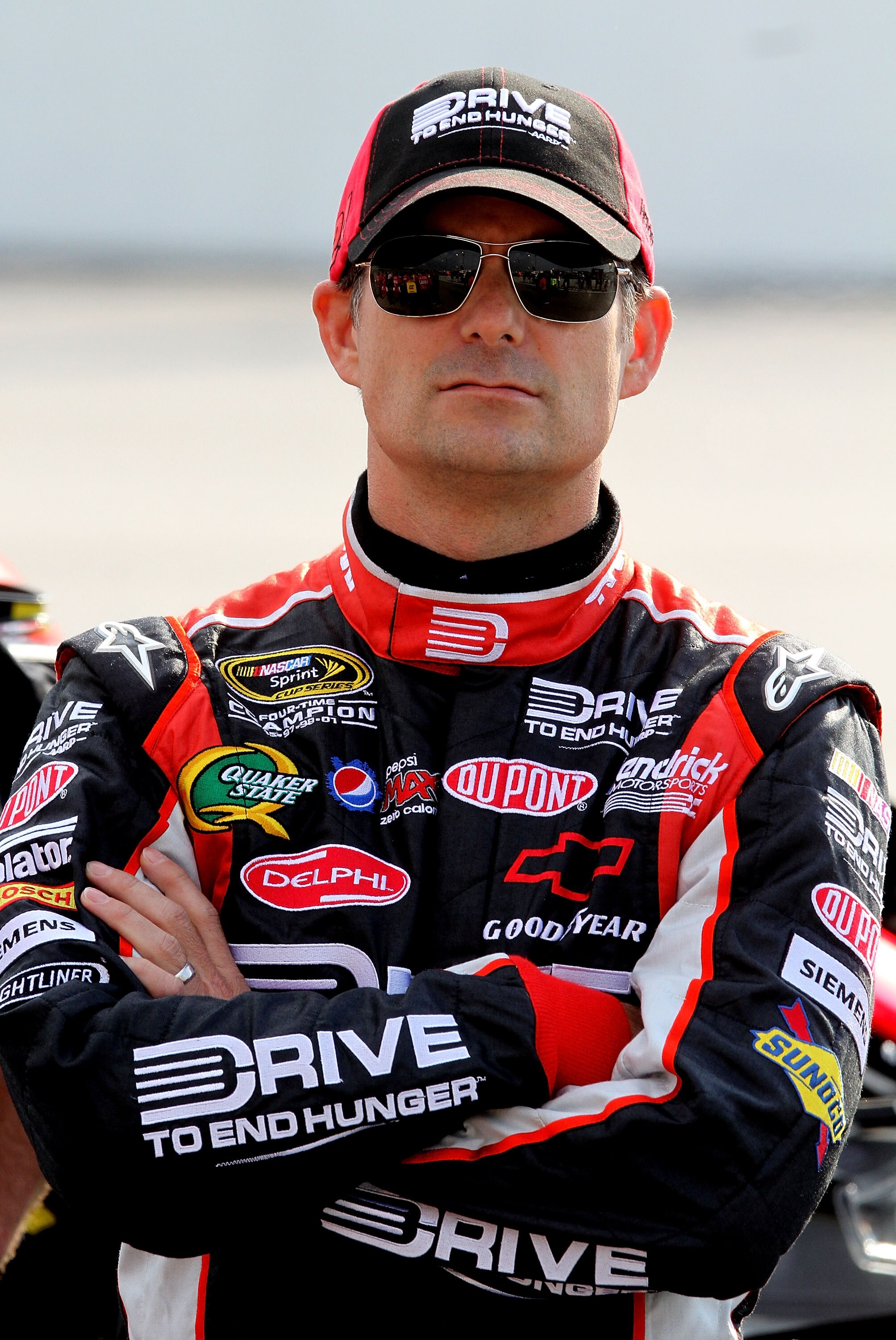 DARLINGTON, SC - MAY 06: Jeff Gordon, driver of the #24 Drive to End Hunger / AARP Chevrolet stands on pit road during qualifying for the NASCAR Sprint Cup Series SHOWTIME Southern 500 at Darlington Raceway on May 6, 2011 in Darlington, South Carolina.  (