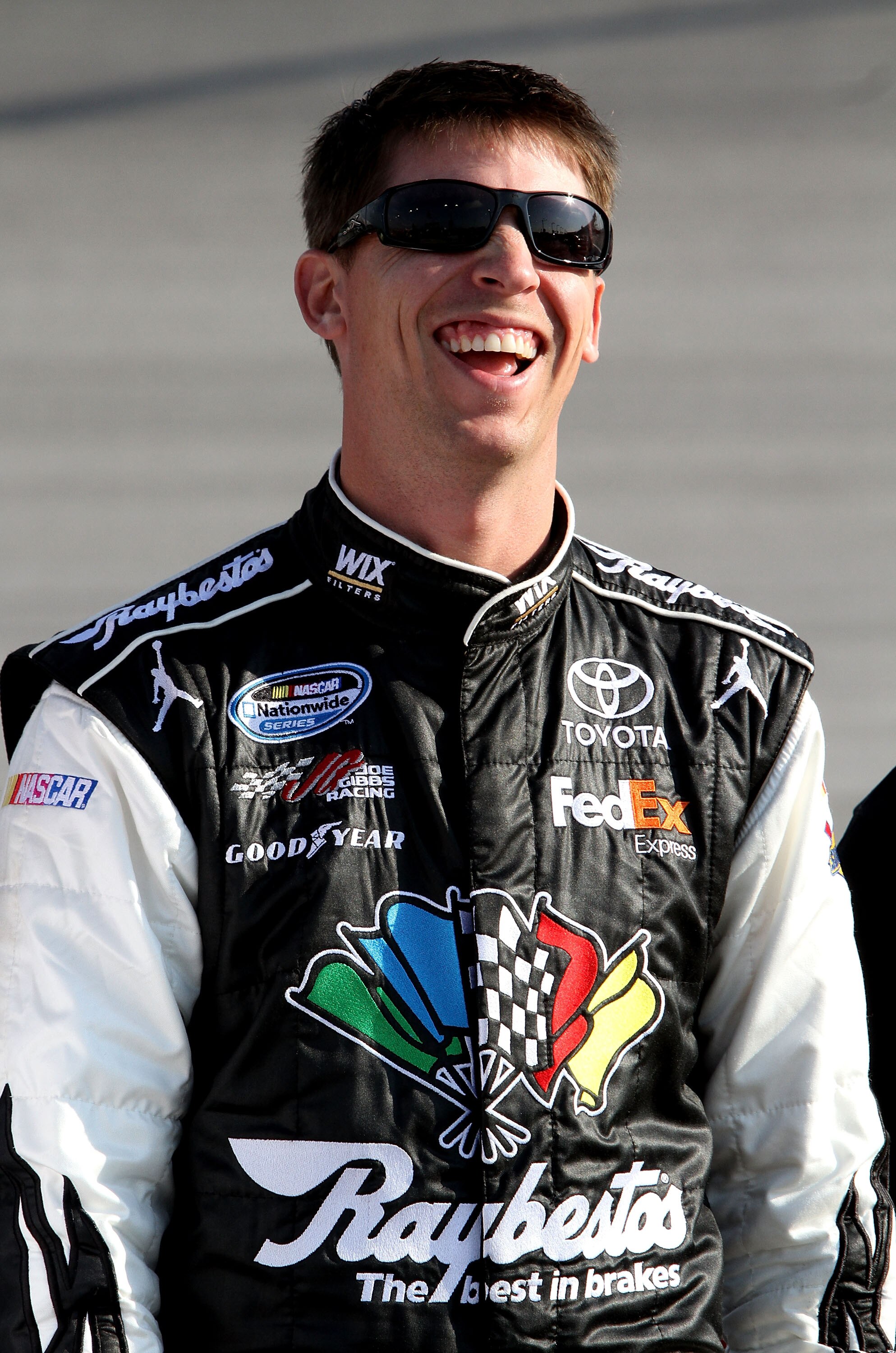 DARLINGTON, SC - MAY 06:  Denny Hamlin, driver of the #11 Sport Clips Toyota, stands on the grid during qualifying for the NASCAR Sprint Cup Series SHOWTIME Southern 500 at Darlington Raceway on May 6, 2011 in Darlington, South Carolina.  (Photo by Jerry