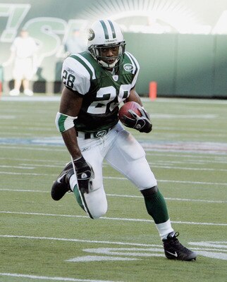 EAST RUTHERFORD, NJ - SEPTEMBER 18: Running back Curtis Martin #28 of the New York Jets runs against the Miami Dolphins during their game on September 18, 2005 at Giants Stadium in East Rutherford, New Jersey. The Jets defeated the Dolphins 17-7. (Photo b
