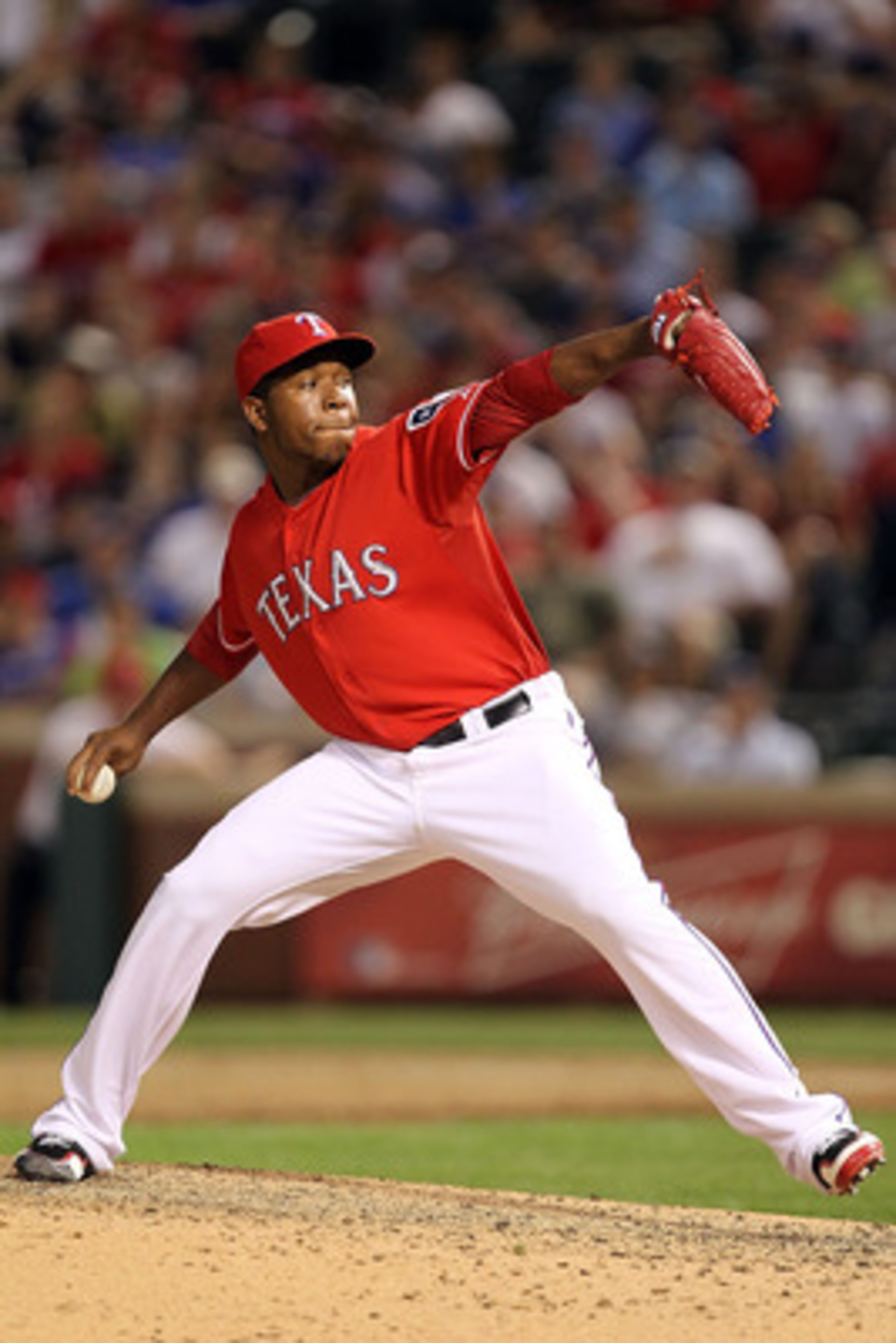 ARLINGTON, TX - MAY 07:  Pitcher Neftali Feliz #30 of the Texas Rangers throws against the New York Yankees at Rangers Ballpark in Arlington on May 7, 2011 in Arlington, Texas.  (Photo by Ronald Martinez/Getty Images)