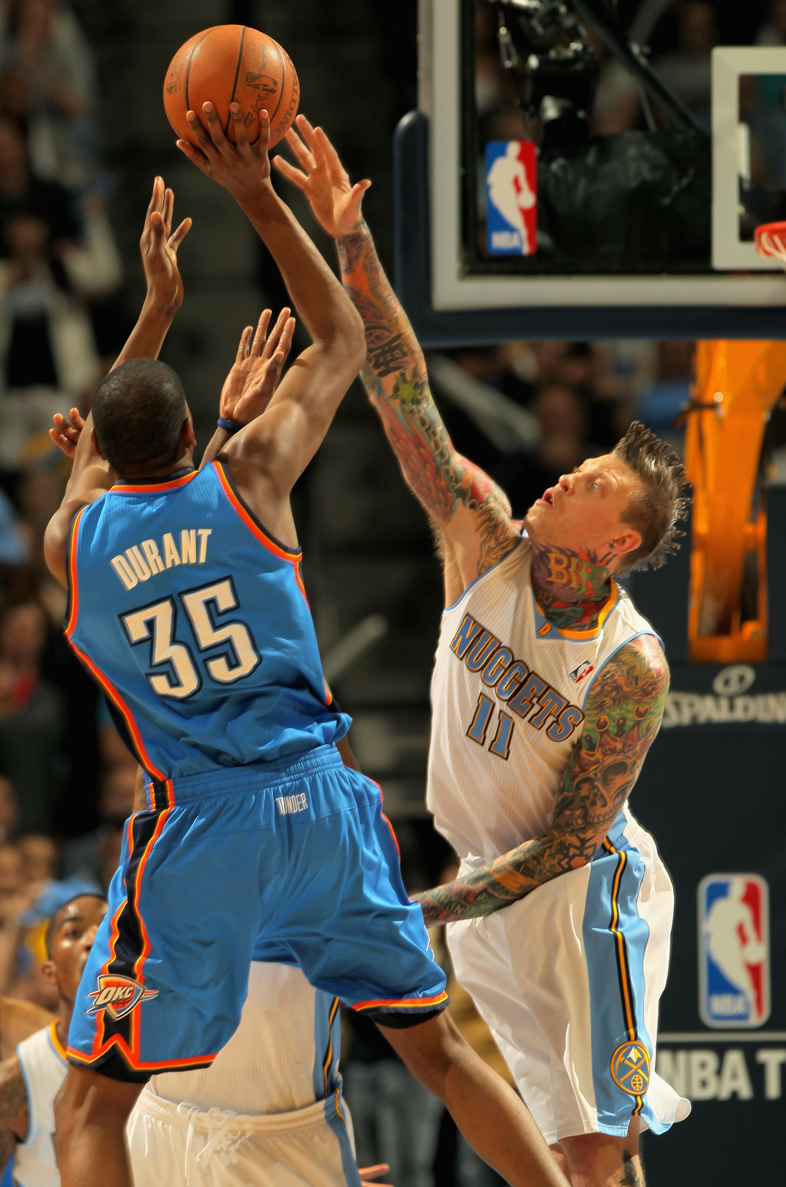 DENVER, CO - APRIL 25:  Kevin Durant #35 of the Oklahoma City Thunder takes a shot against the defense of Chris Andersen #11 of the Denver Nuggets in Game Four of the Western Conference Quarterfinals in the 2011 NBA Playoffs on April 24, 2011 at the Pepsi
