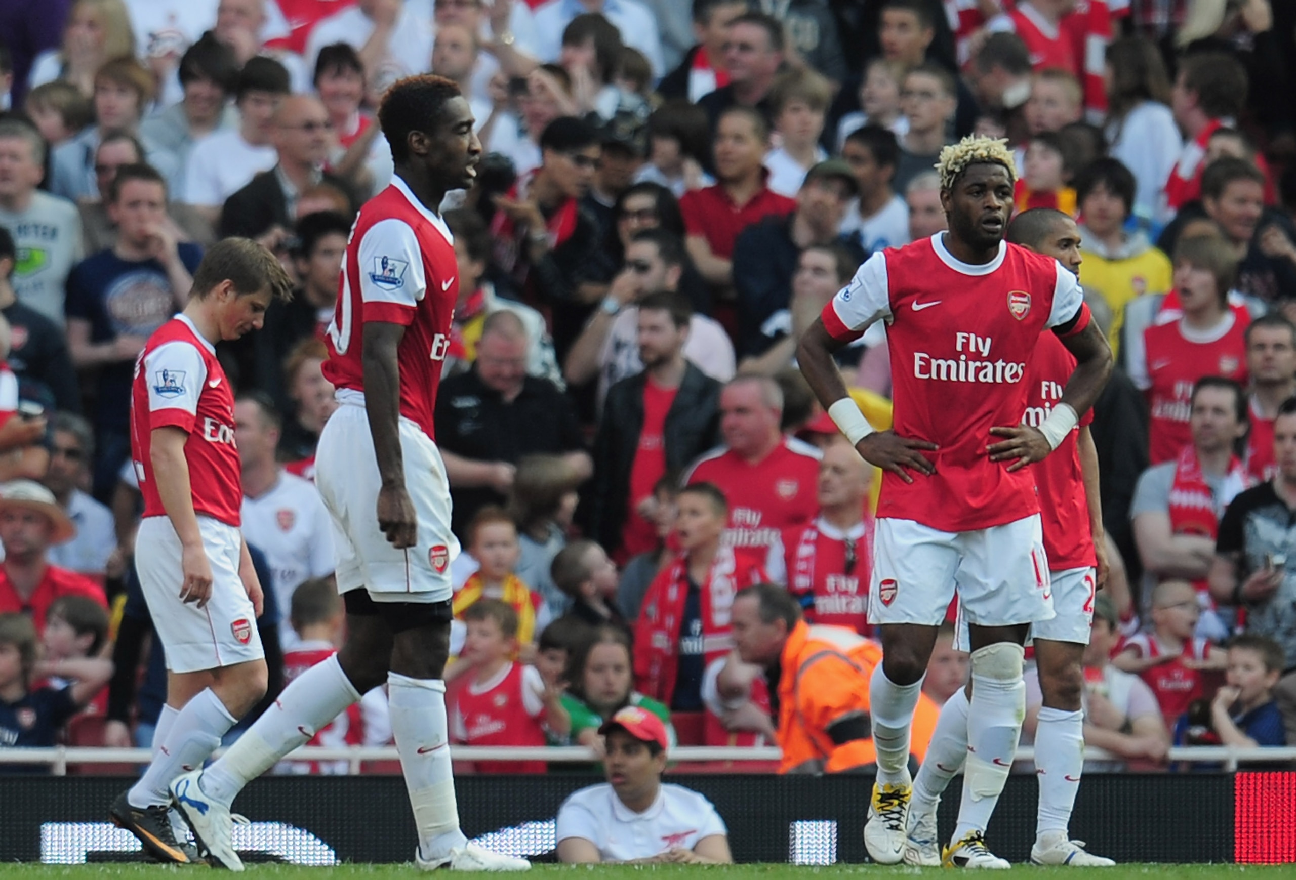 LONDON, ENGLAND - APRIL 17: (L_R) Dejected Andrey Arshavin, Johan Djourou and Alex Song of Arsenal after referee Andre Marriner awards Liverpool a penalty kick and they equalise during the Barclays Premier League match between Arsenal and Liverpool at th LONDON, ENGLAND - APRIL 17: (L_R) Dejected Andrey Arshavin, Johan Djourou and Alex Song of Arsenal after referee Andre Marriner awards Liverpool a penalty kick and they equalise during the Barclays Premier League match between Arsenal and Liverpool at th