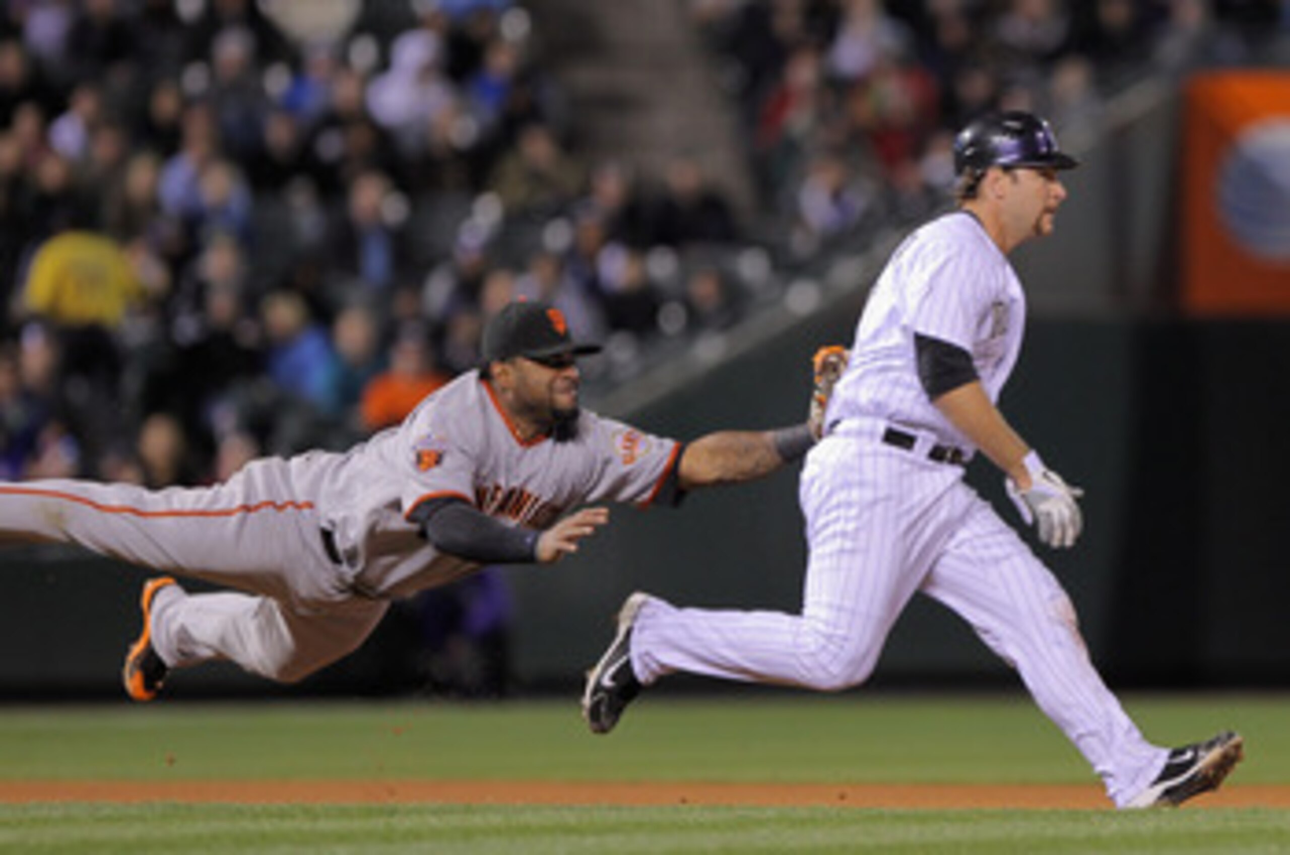 DENVER, CO - APRIL 19:  Thirdbaseman Pablo Sandoval #48 of the San Francisco Giants tags out Chris Iannetta #20 of the Colorado Rockies for the final out of the fifth inning at Coors Field on April 19, 2011 in Denver, Colorado.  (Photo by Doug Pensinger/G