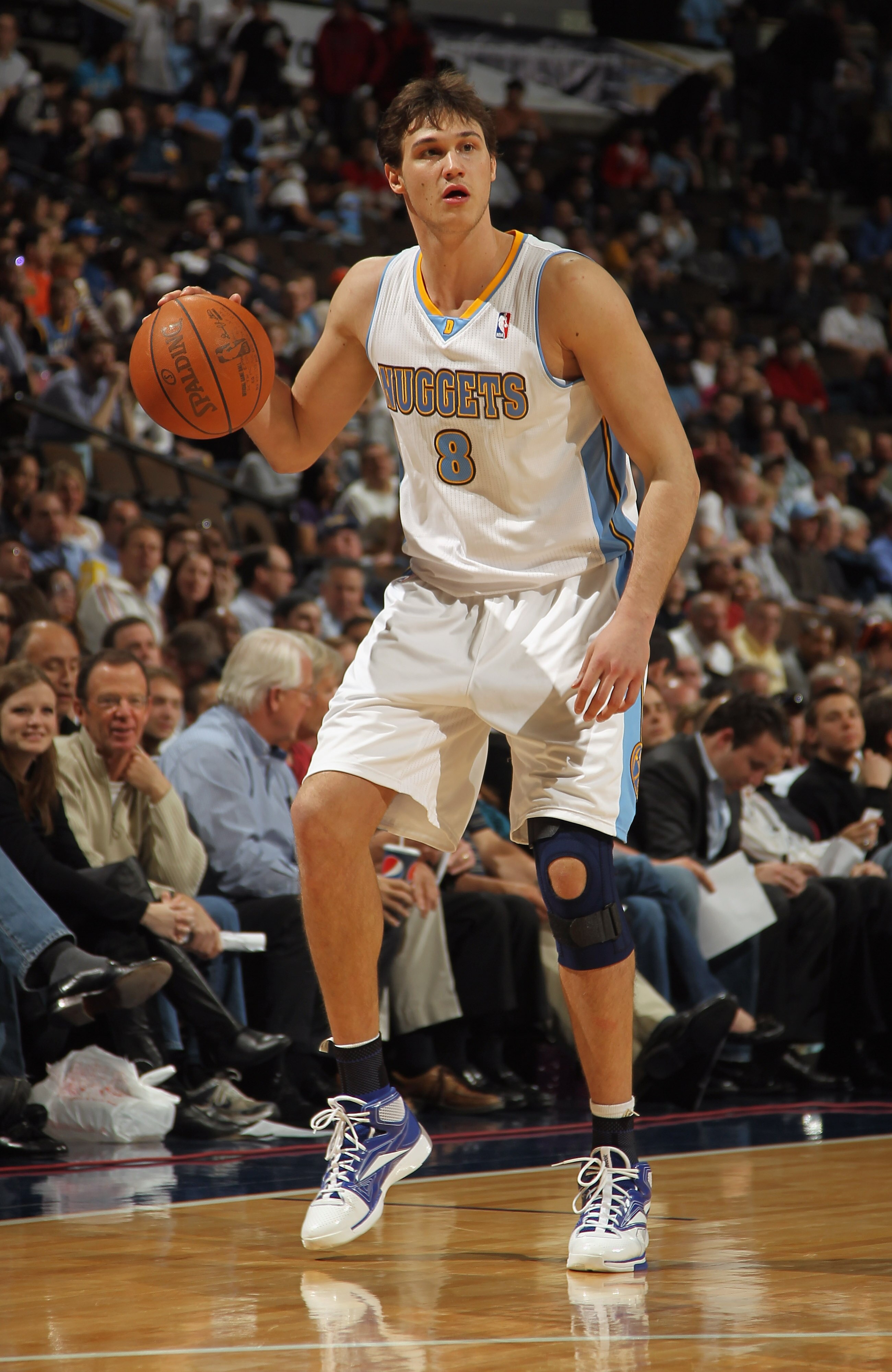 DENVER, CO - MARCH 21:  Danilo Gallinari #8 of the Denver Nuggets controls the ball against the Toronto Raptors at the Pepsi Center on March 21, 2011 in Denver, Colorado. The Nuggets defeated the Raptors 123-90. NOTE TO USER: User expressly acknowledges a