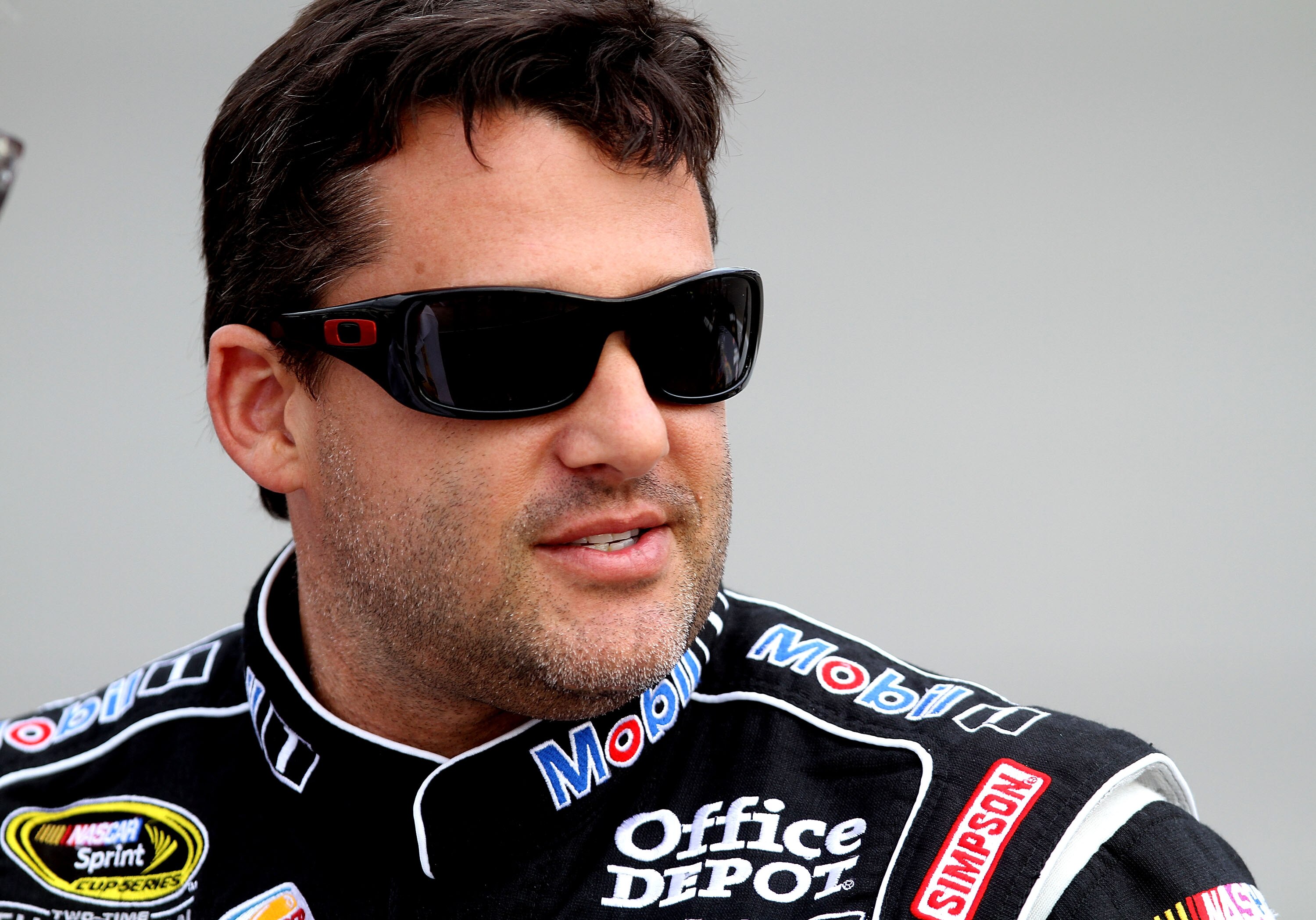 RICHMOND, VA - APRIL 29:  Tony Stewart, driver of the #14 Mobil 1/Office Depot Chevrolet, stands on pit road during qualifying for the NASCAR Sprint Cup Series Crown Royal Presents The Matthew & Daniel Hansen 400 at Richmond International Raceway on April