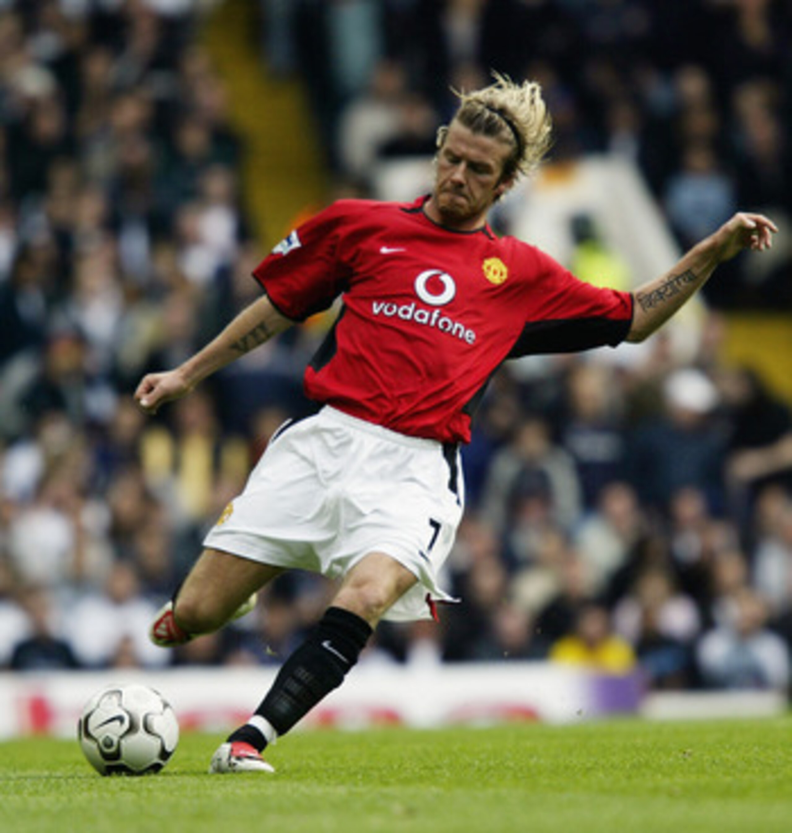 LONDON - APRIL 27:   David Beckham of Manchester United strikes the ball during the FA Barclaycard Premiership match between Tottenham Hotspur and Manchester United on April 27, 2003 at White Hart Lane in London. Manchester United won the match 2-0. (Phot