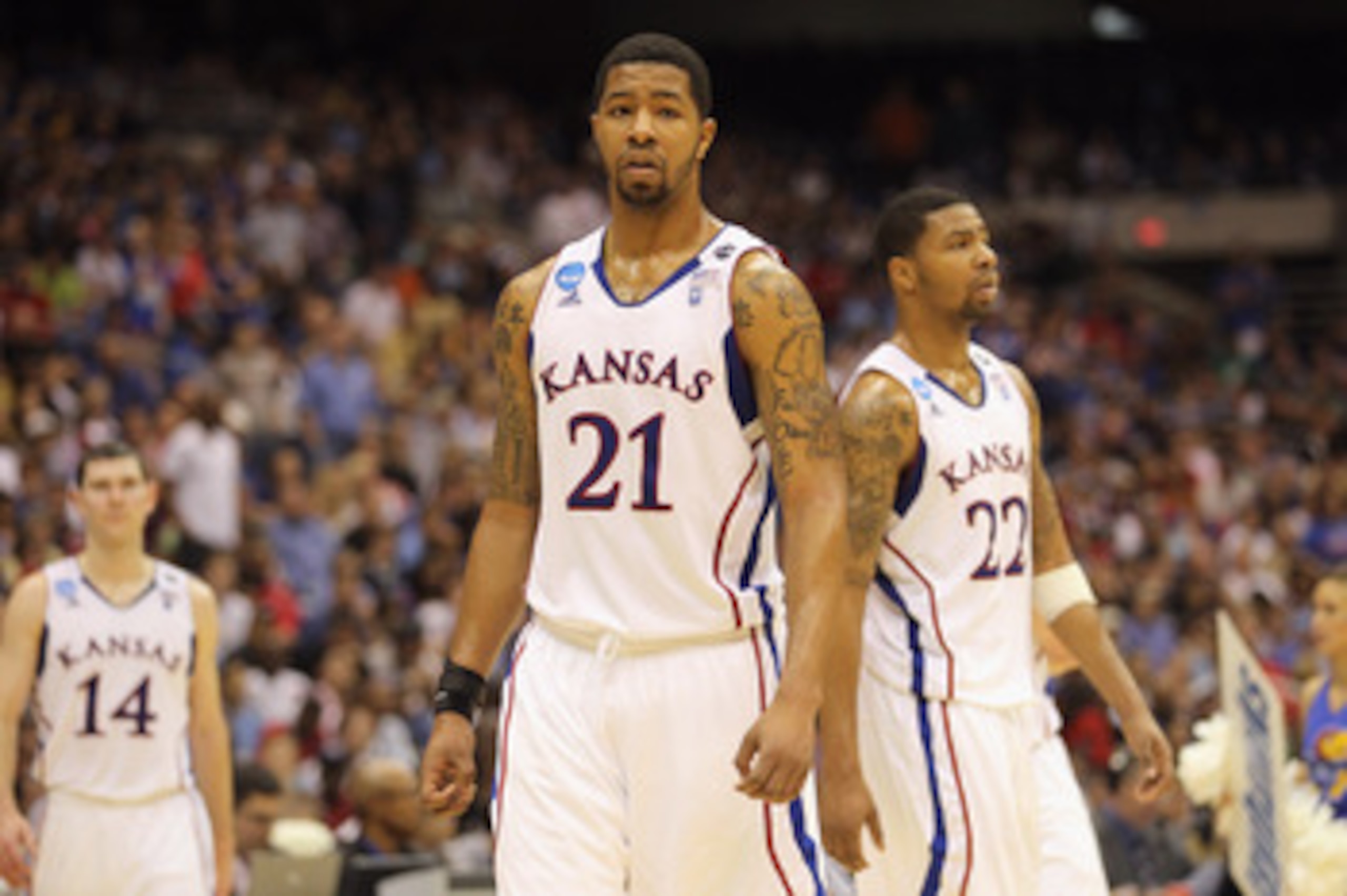 SAN ANTONIO, TX - MARCH 27:  Markieff Morris #21 and Marcus Morris #22 of the Kansas Jayhawks react during the southwest regional final of the 2011 NCAA men's basketball tournament against the Virginia Commonwealth Rams at the Alamodome on March 27, 2011 