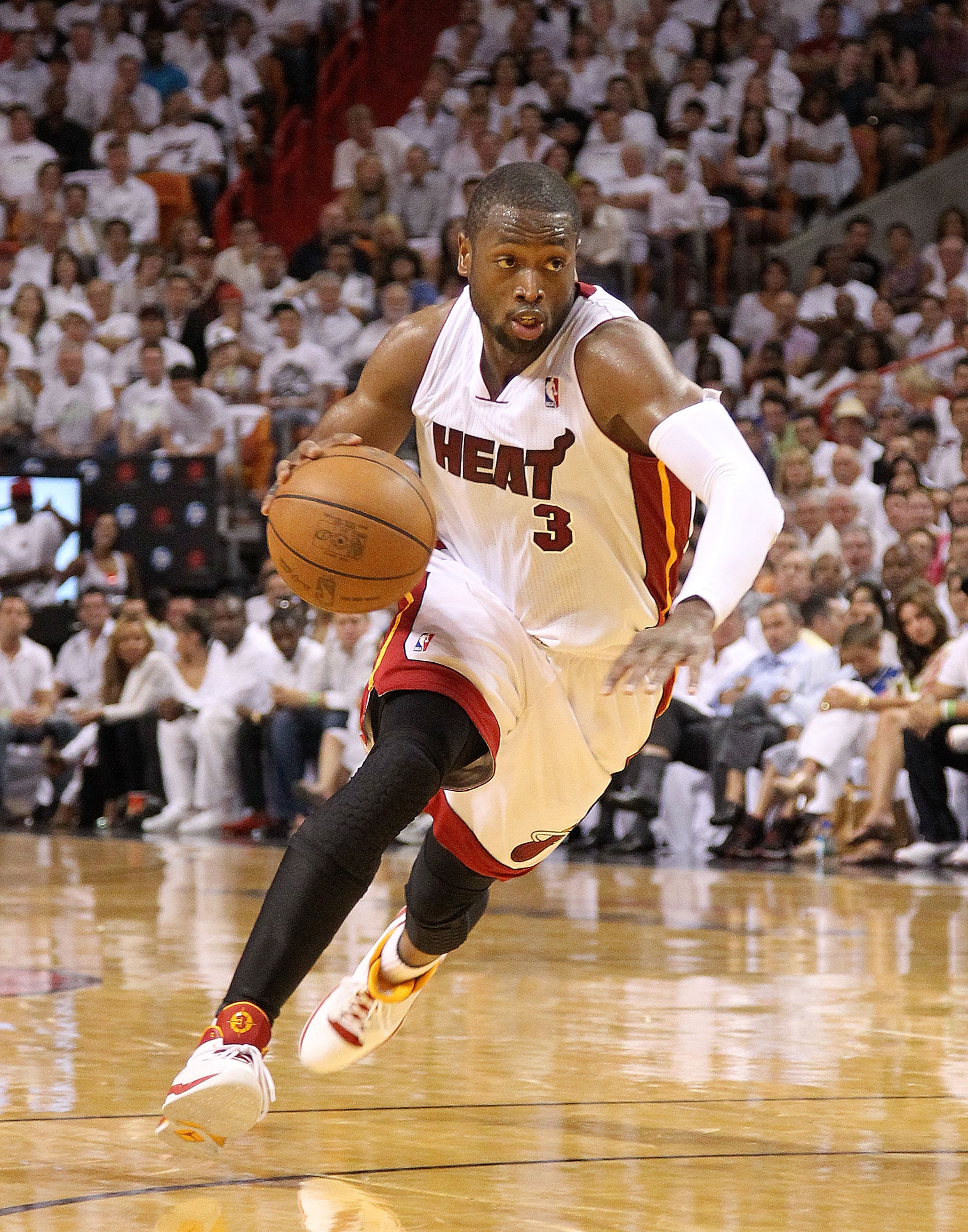 MIAMI, FL - APRIL 27:  Dwyane Wade #3 of the Miami Heat drives to the lane during game five of the Eastern Conference Quarterfinals in the 2011 NBA Playoffs against the Philadelphia 76ers at American Airlines Arena on April 27, 2011 in Miami, Florida. NOT