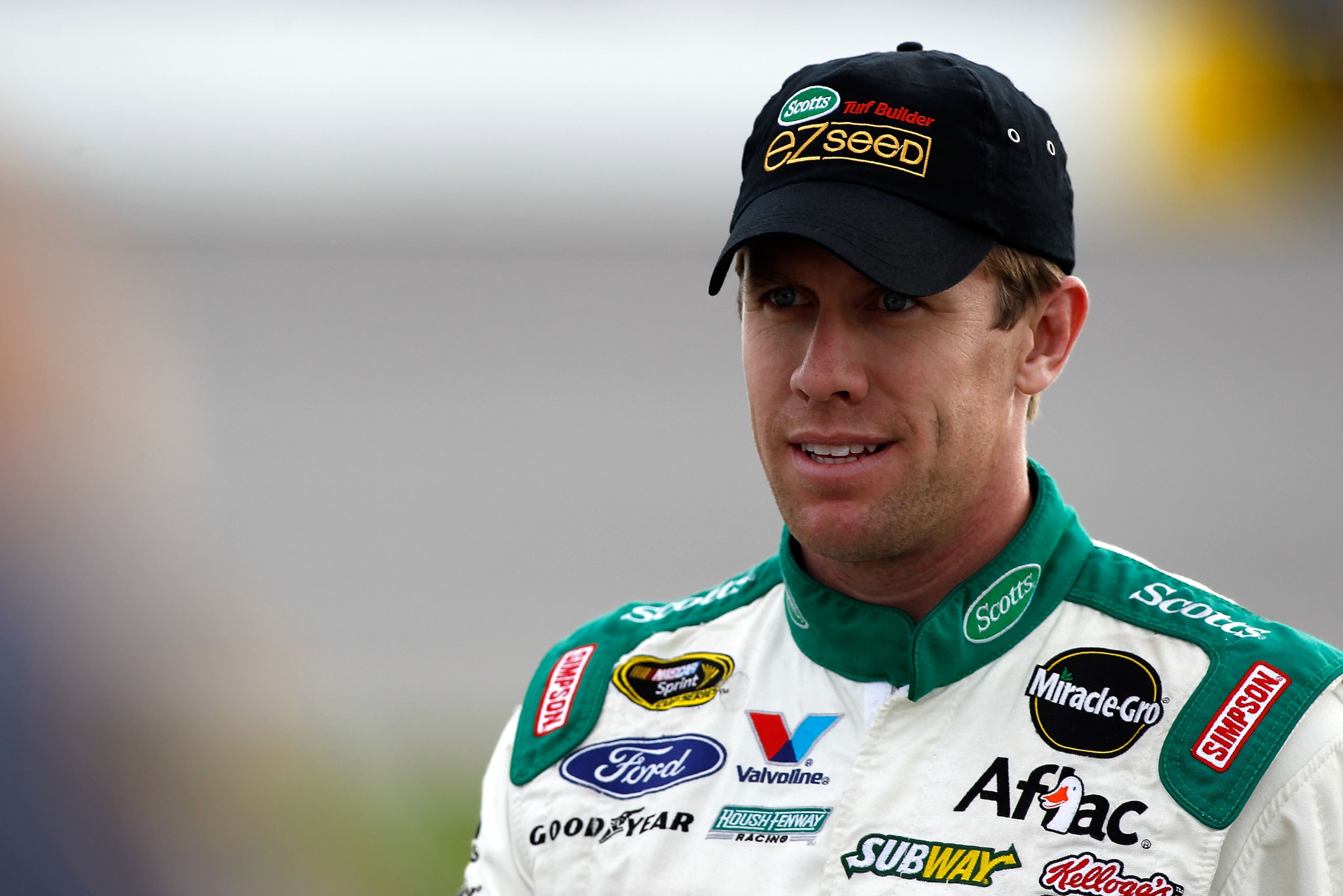 RICHMOND, VA - APRIL 29:  Carl Edwards, driver of the #99 Scotts EZ Seed Ford, stands on pit road during qualifying for the NASCAR Sprint Cup Series Crown Royal Presents The Matthew & Daniel Hansen 400 at Richmond International Raceway on April 29, 2011 i