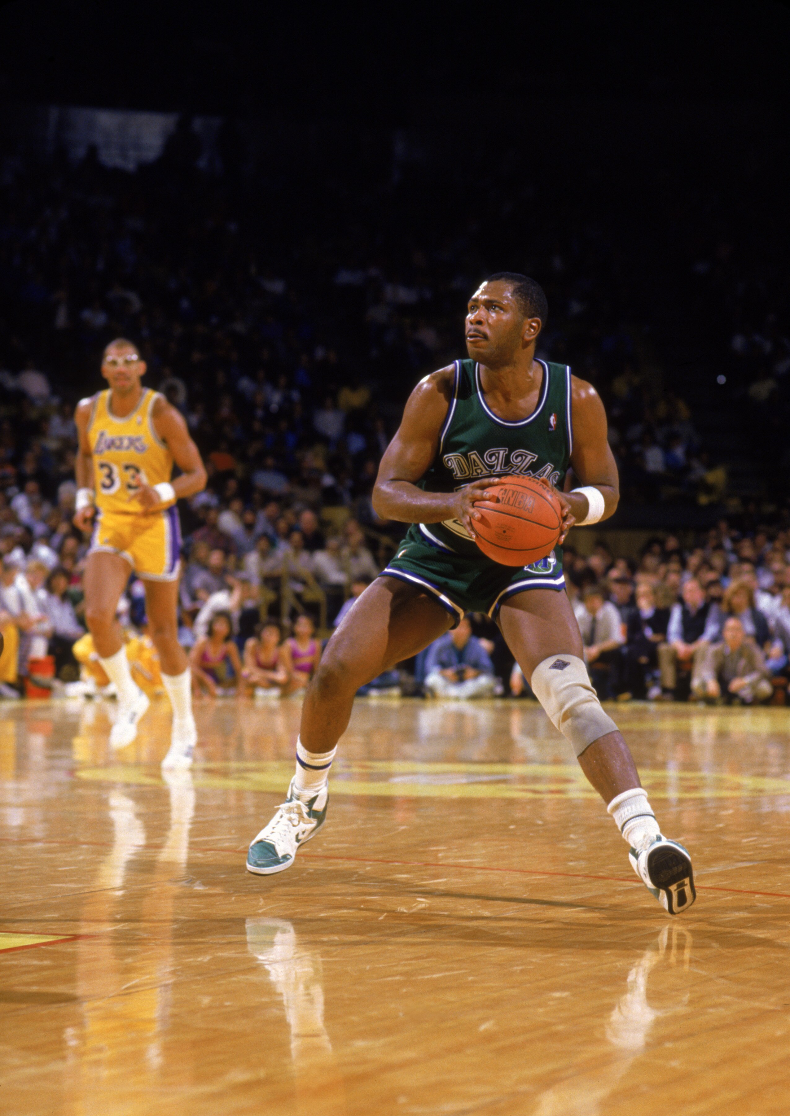 LOS ANGELES - 1988:  Mark Aguirre #24 of the Dallas Mavericks moves the ball during the NBA game against the Los Angeles Lakers at the Great Western Forum in Los Angeles, California in 1988.  (Photo by Rick Stewart/Getty Images)