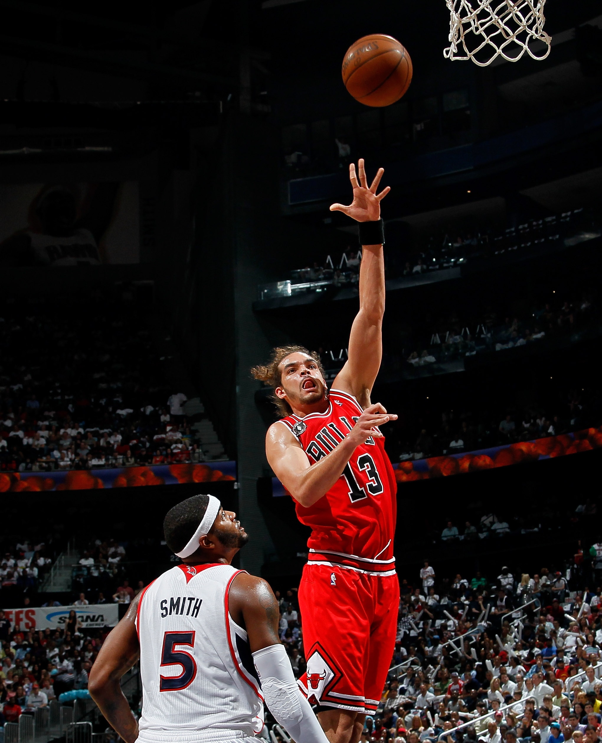 ATLANTA, GA - MAY 08:  Joakim Noah #13 of the Chicago Bulls shoots over Josh Smith #5 of the Atlanta Hawks in Game Four of the Eastern Conference Semifinals in the 2011 NBA Playoffs at Phillips Arena on May 8, 2011 in Atlanta, Georgia.  NOTE TO USER: User