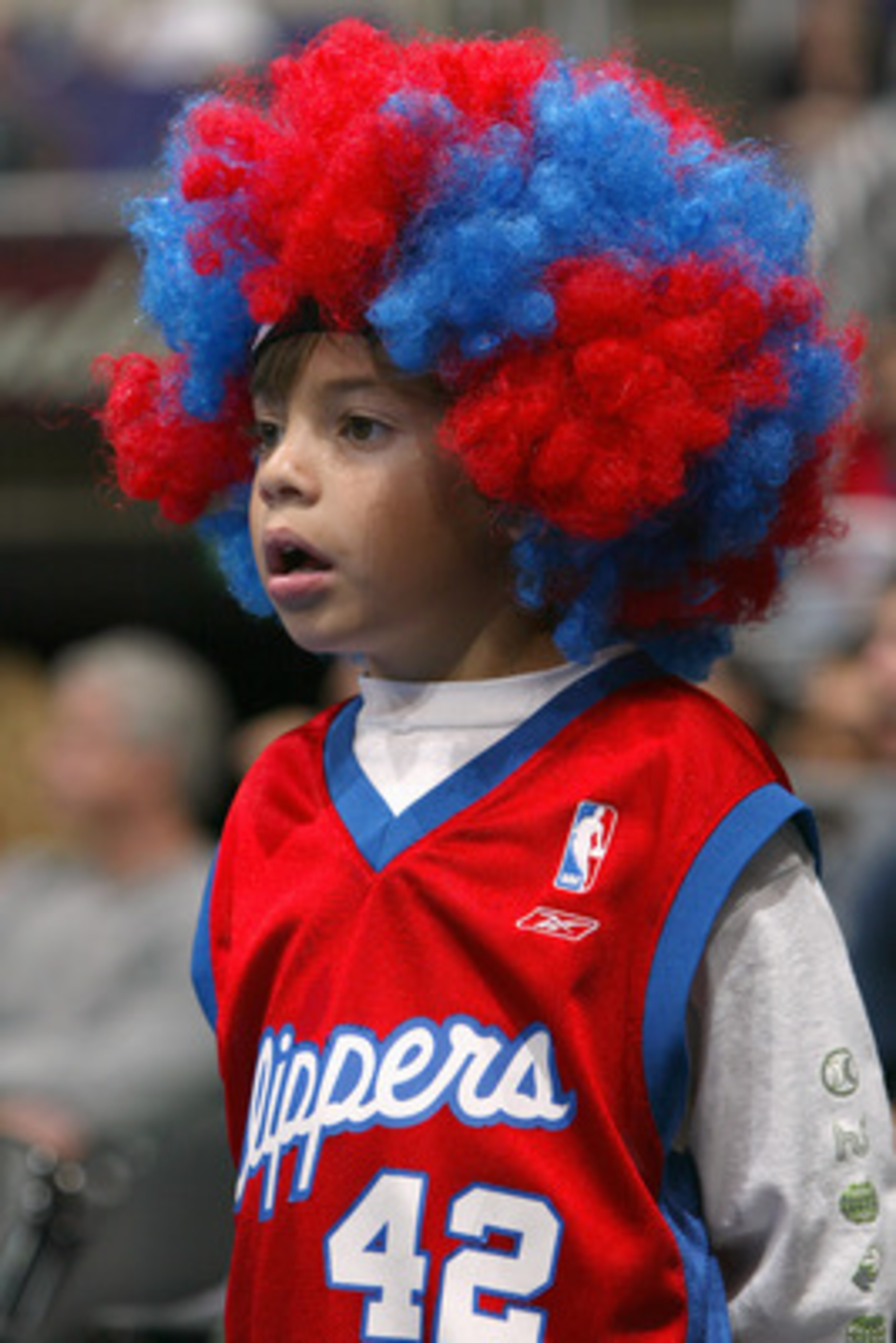 LOS ANGELES - OCTOBER 24:  A Los Angeles Clippers fan watches the action during a preseason game against the New Orleans Hornets on October 24, 2004 at Staples Center in Los Angeles, California. The Clippers won 97-93. NOTE TO USER: User expressly acknowl