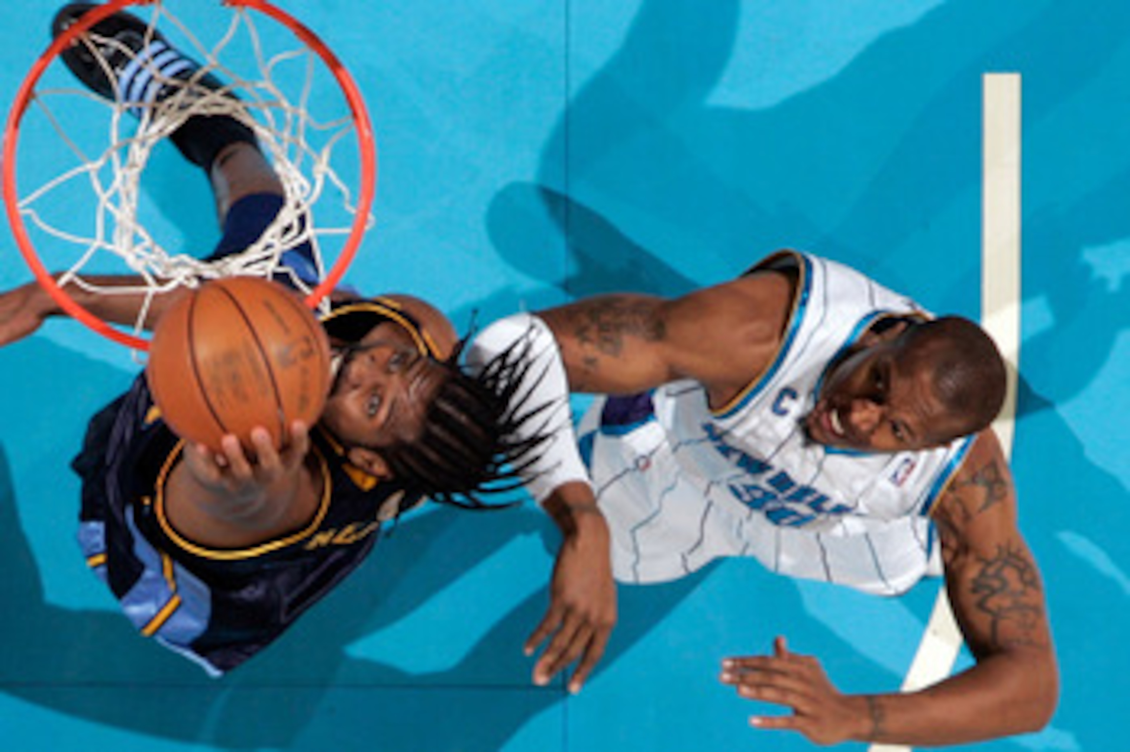 NEW ORLEANS - DECEMBER 18: Nene #31 of the Denver Nuggets makes a shot over David West #30 of the New Orleans Hornets at New Orleans Arena on December 18, 2009 in New Orleans, Louisiana. The Hornets defeated the Nuggets 98-92. NOTE TO USER: User expres NEW ORLEANS - DECEMBER 18: Nene #31 of the Denver Nuggets makes a shot over David West #30 of the New Orleans Hornets at New Orleans Arena on December 18, 2009 in New Orleans, Louisiana. The Hornets defeated the Nuggets 98-92. NOTE TO USER: User expres