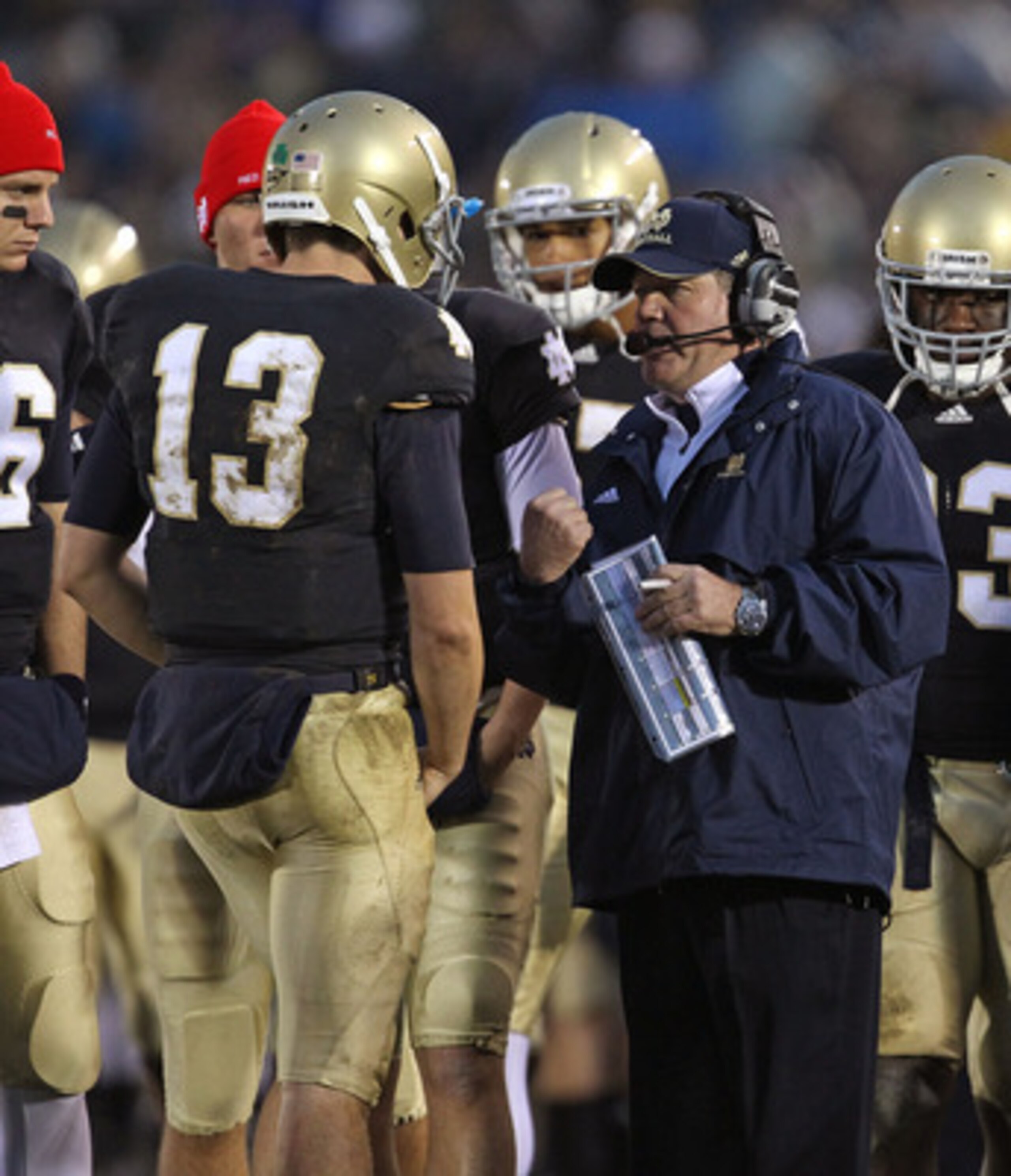 SOUTH BEND, IN - NOVEMBER 13: Head coach Brian Kelly of the Notre Dame Fighting Irish talks with Tommy Rees #13 during a game against the Utah Utes at Notre Dame Stadium on November 13, 2010 in South Bend, Indiana. Notre Dame defeated Utah 28-3. (Photo by