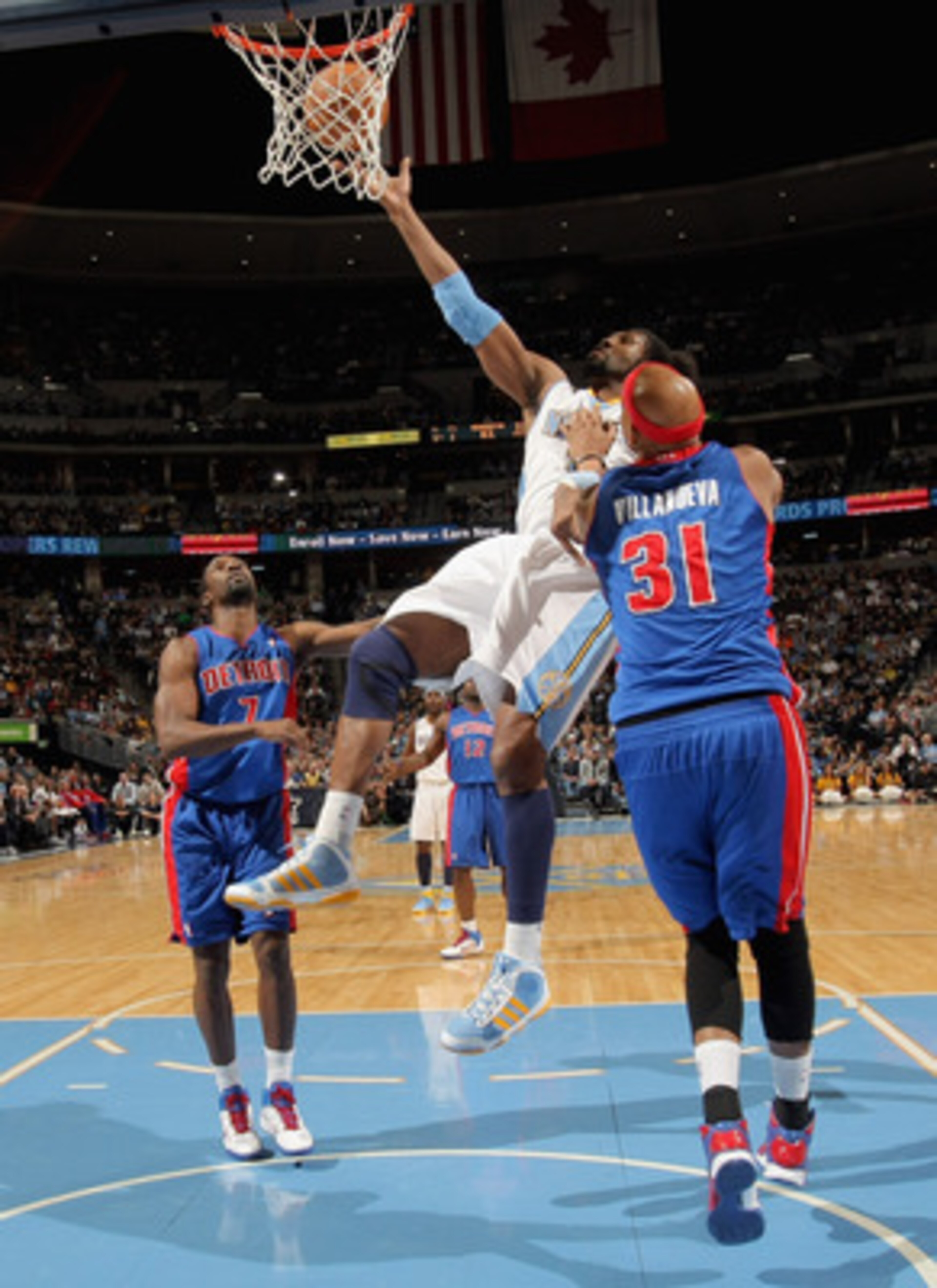 DENVER, CO - MARCH 12: Nene #31 of the Denver Nuggets is fouled by Charlie Villanueva #31 of the Detroit Pistons as he goes to the basket at the Pepsi Center on March 12, 2011 in Denver, Colorado. NOTE TO USER: User expressly acknowledges and agrees that DENVER, CO - MARCH 12: Nene #31 of the Denver Nuggets is fouled by Charlie Villanueva #31 of the Detroit Pistons as he goes to the basket at the Pepsi Center on March 12, 2011 in Denver, Colorado. NOTE TO USER: User expressly acknowledges and agrees that